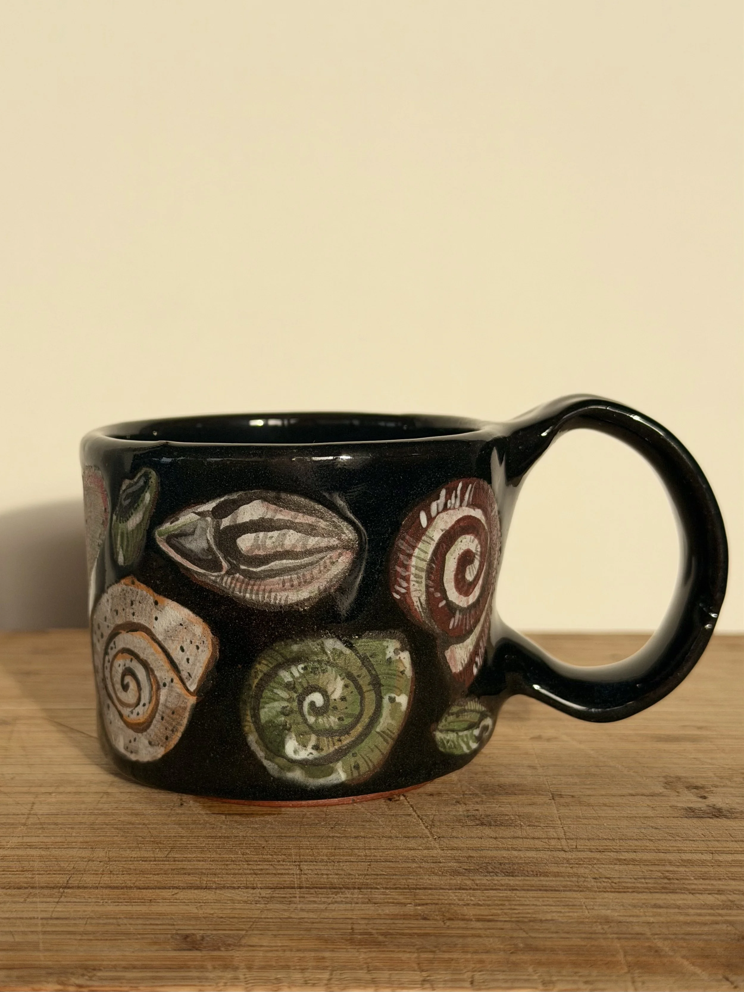 Shells on her mug