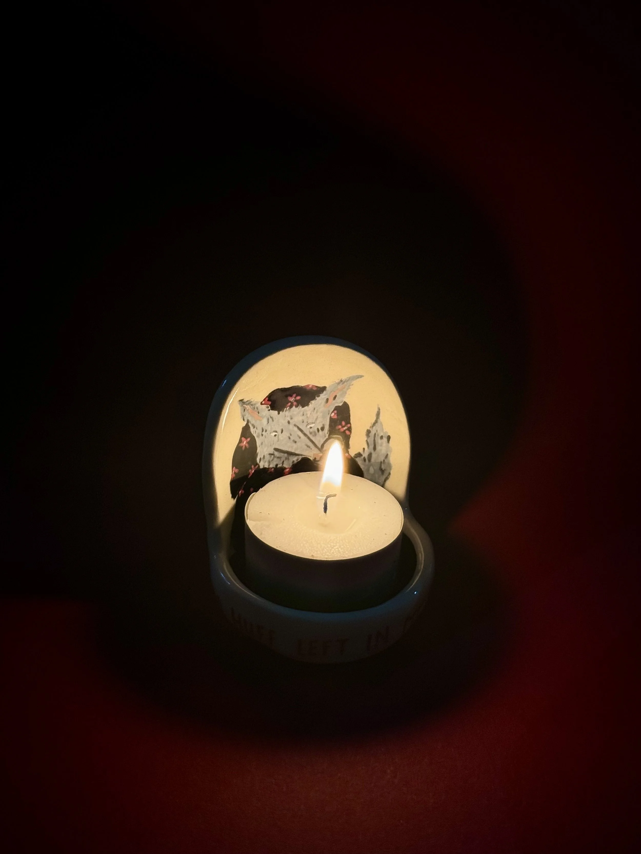 Huff and puff tea light holder