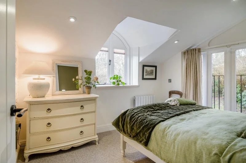 Bedroom One: Featuring arch window with view to garden