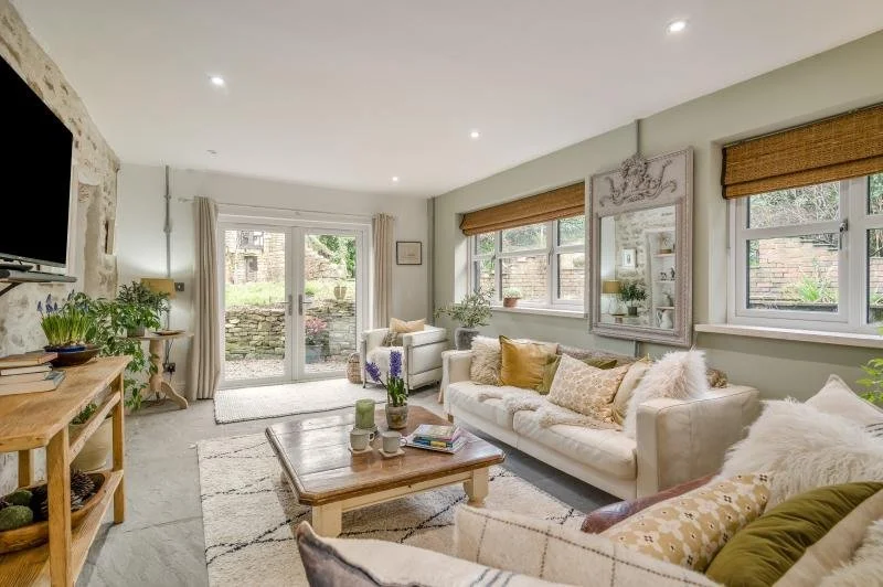 Living room with French doors leading out to enclosed garden