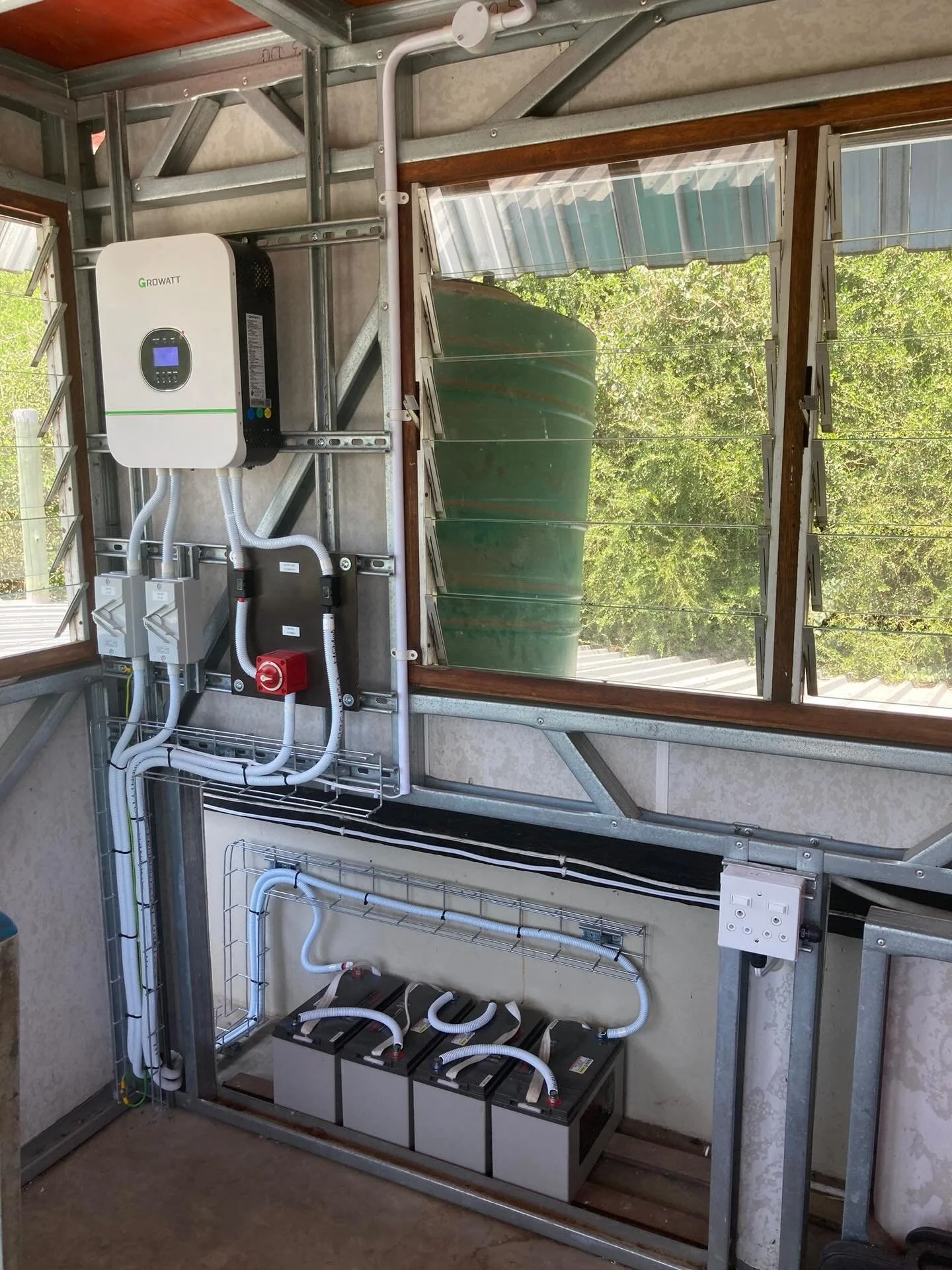 Backup Power Installation in a remote location in South Africa for a family member whilst there for a visit. Consisting of: 3KW Growatt Inverter charger, 4x 12V Deep Cycle batteries, Uni-strut frame and cable basket containment, bespoke made battery 
