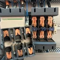 Electrical circuit breakers mounted on a panel.