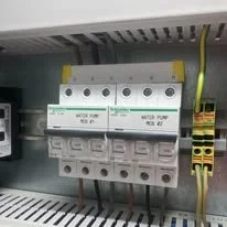 Electrical circuit breaker panel with switches and wiring.