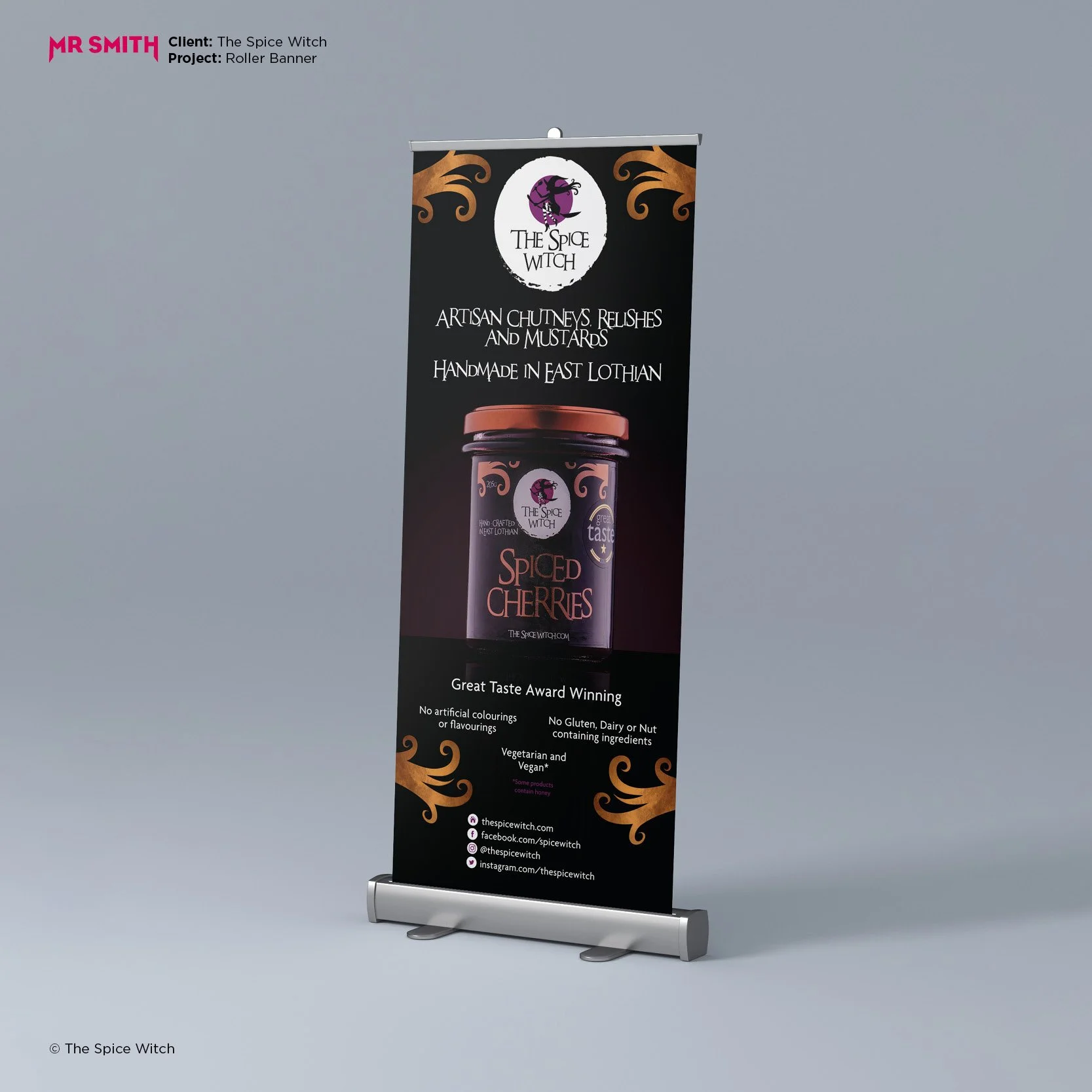 Vertical roller banner for The Spice Witch featuring a logo with a witch's silhouette on a purple moon, product image of cherry spread, and text promoting artisanal chutneys, relishes, and mustards made in East Lothian.