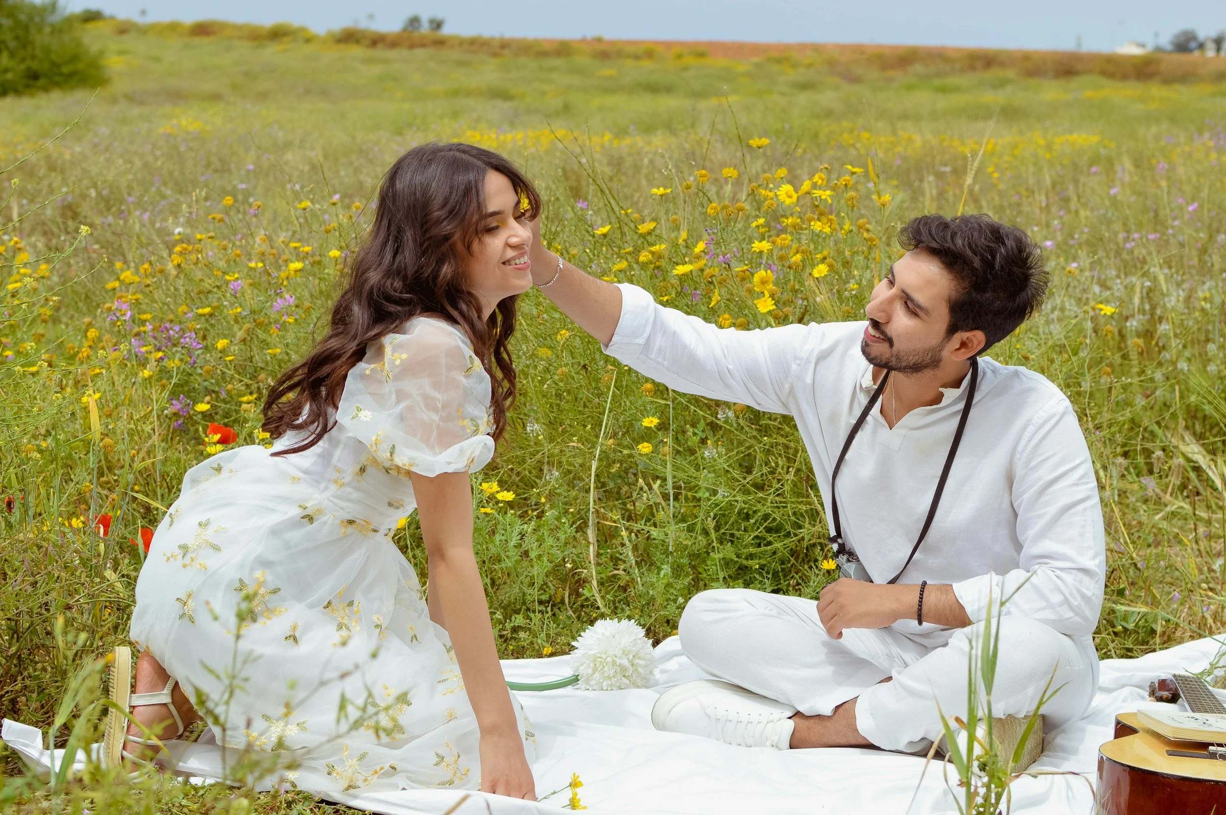 A couple sharing a picnic in the countryside
