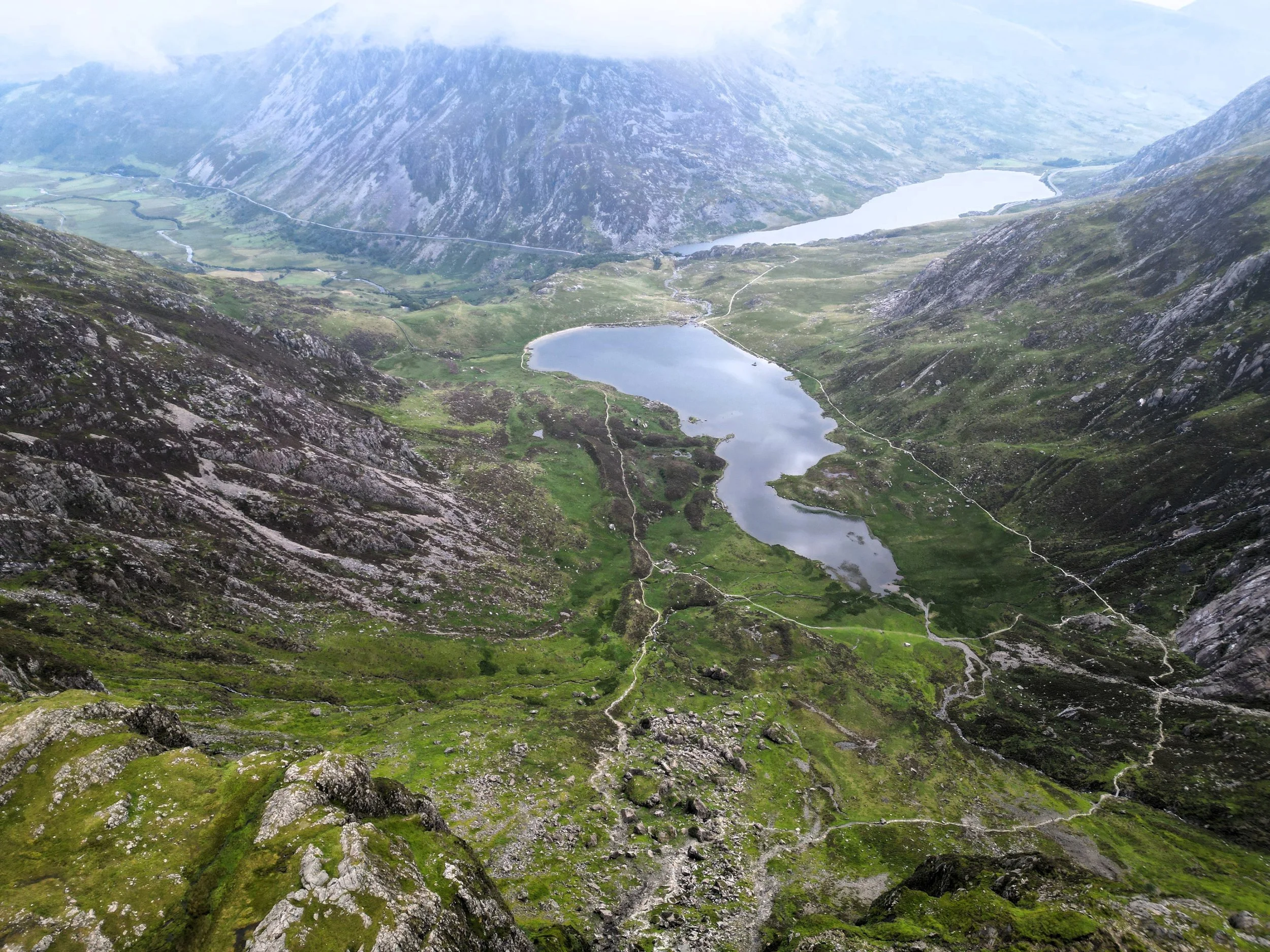 Aerial view of Llyn Idwal in Cwm Idwal, with Llyn Ogwen and the mountains beyond