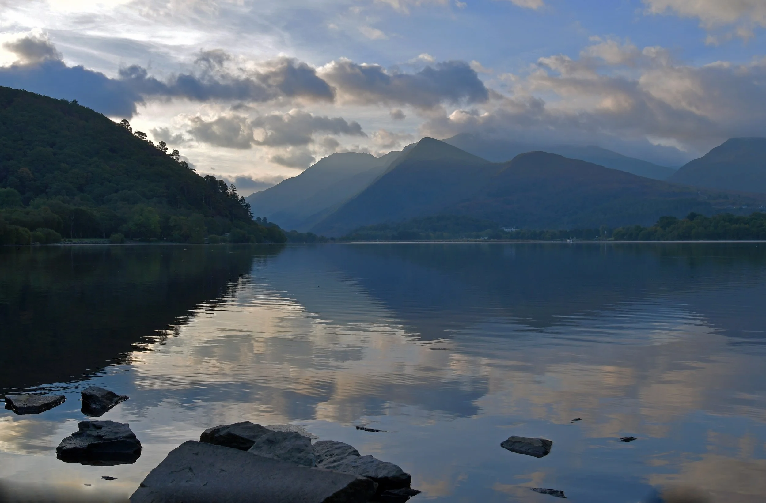 Mountains reflected in the still water of Llyn Padarn at Llanberis on an autumn morning