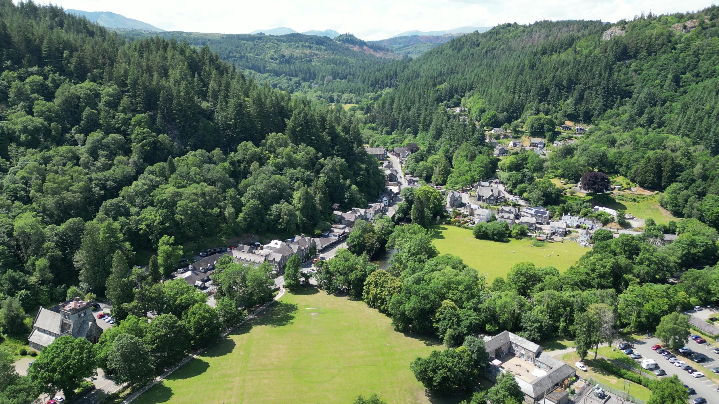 An aerial view of Betws-y-Coed among woodland