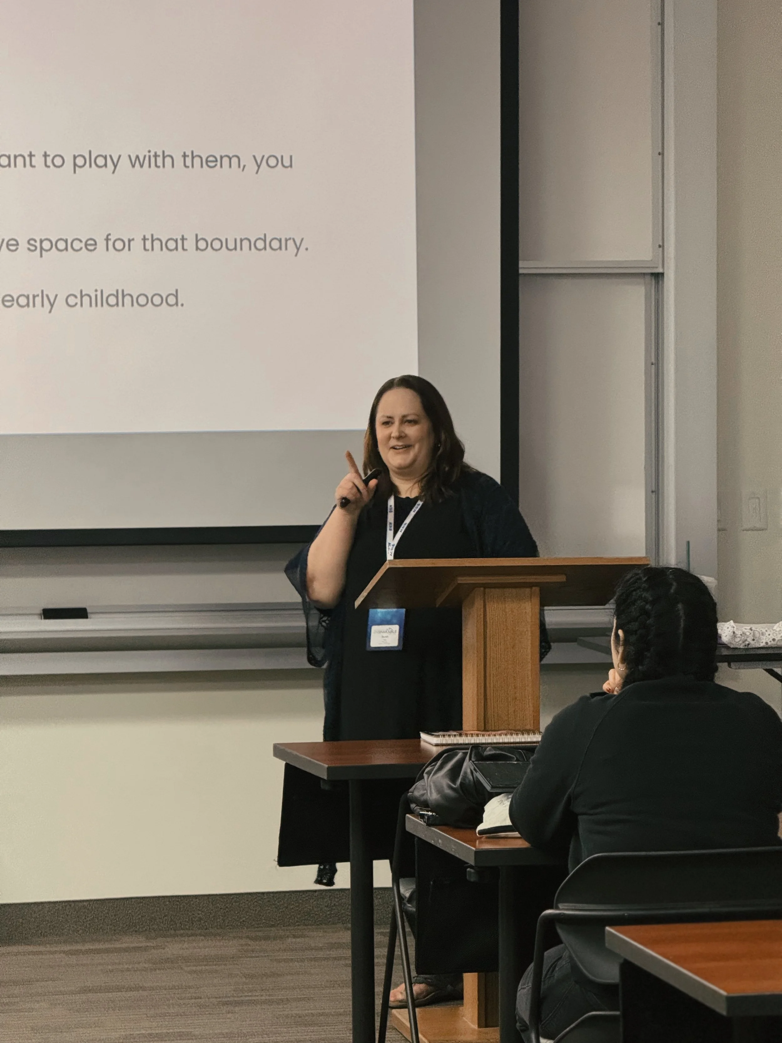 Sarah Pate leading a professional development workshop for early childhood educators on child development and classroom best practices.