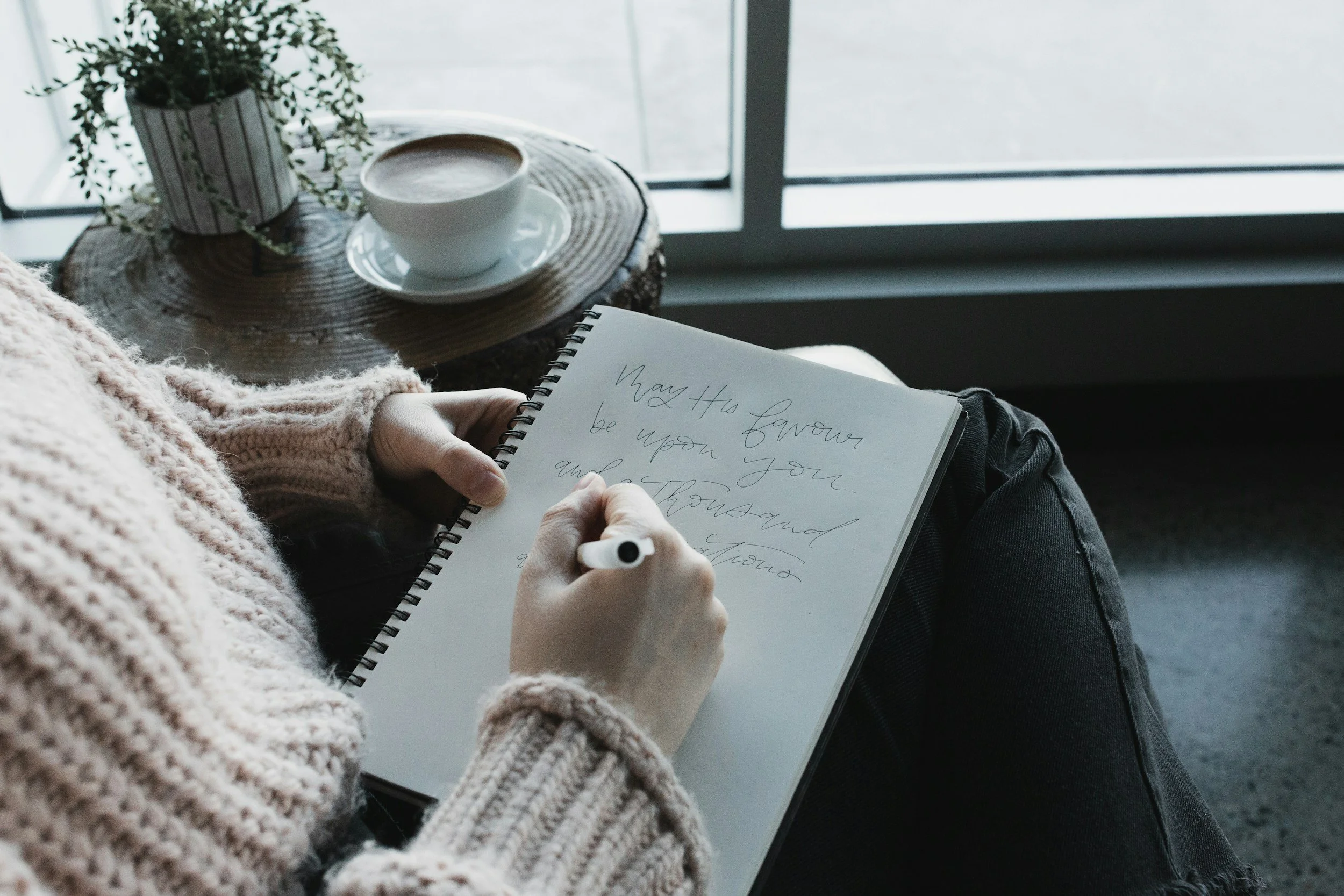 Woman journaling to peace and healing