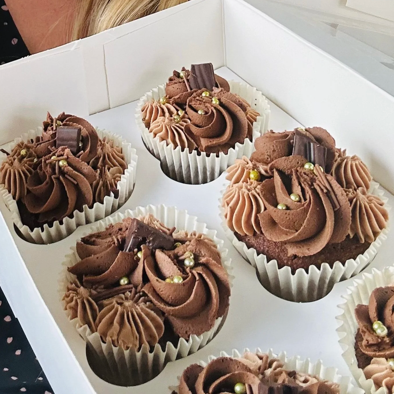 Box of chocolate buttercream cupcakes