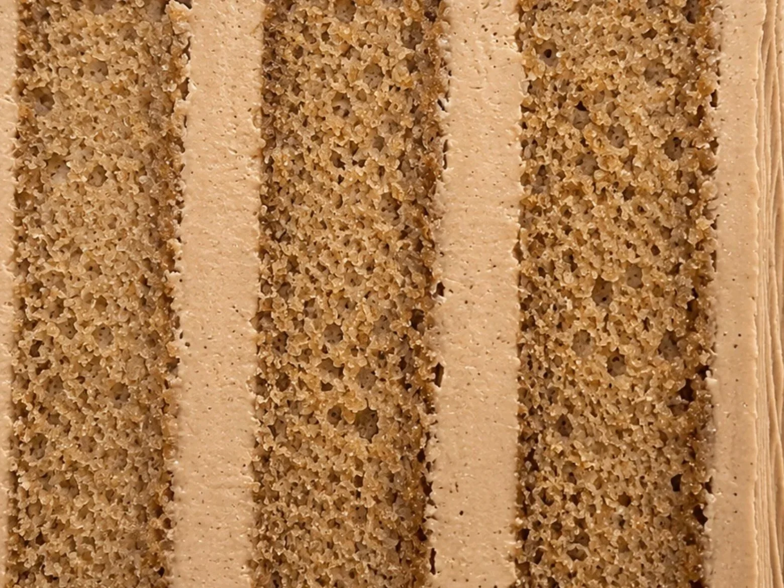 Cross-section of coffee cake layered with coffee buttercream