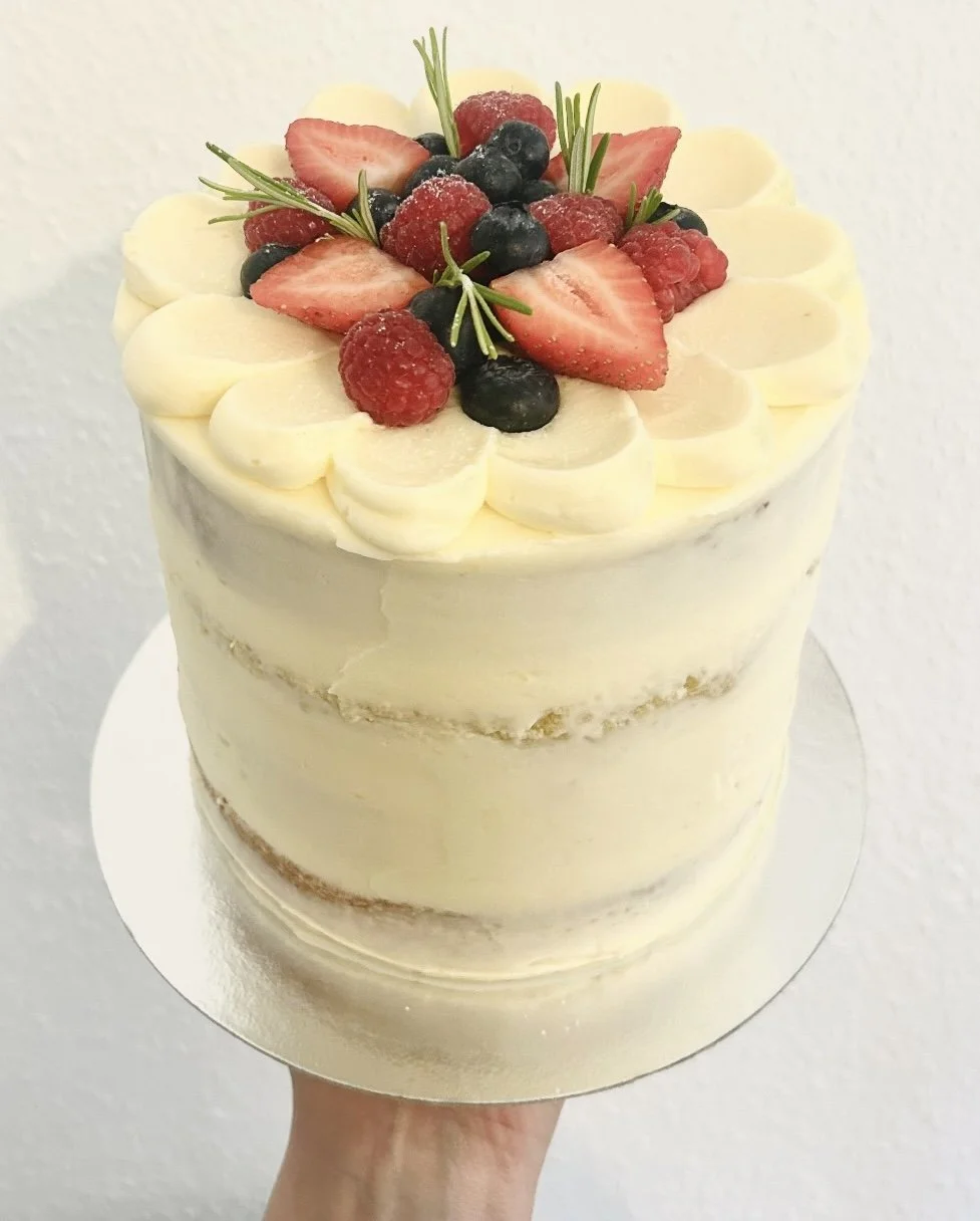 Semi-naked buttercream cake with fresh berries