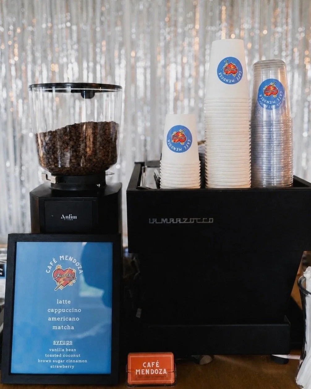 Dallas Coffee Cart Cafe mendoza showcasing custom cups made for an event, along with a custom menu.