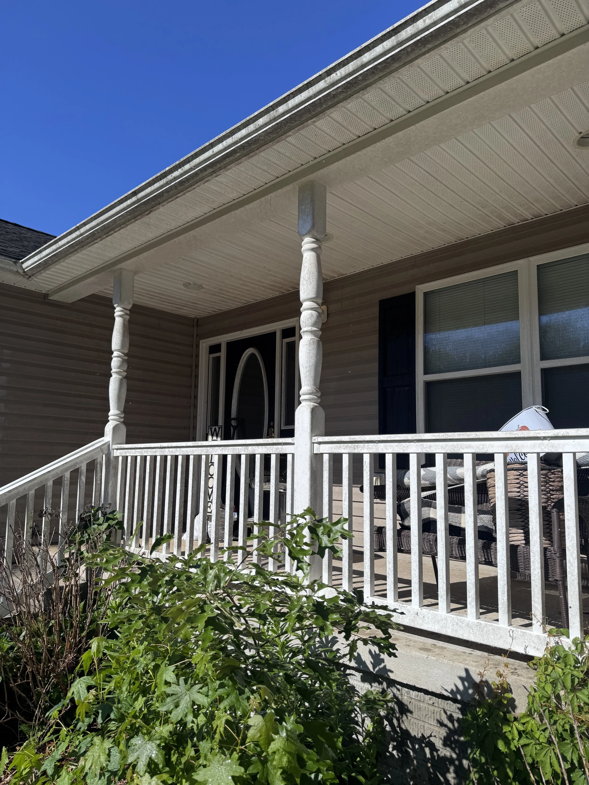 Dirty front porch that needs to be cleaned.