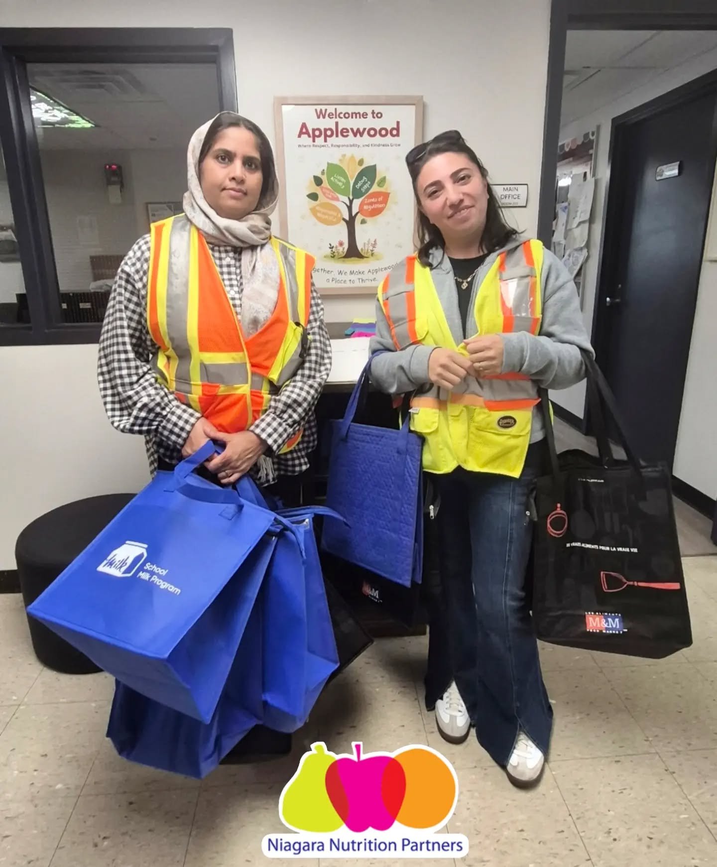Parent volunteers at Applewood Elementary School in St. Catharines provide necessary support to their student nutrition program by filling cooler bags with healthy food, distributing to classrooms, and collecting the bags back up after kids have a ch
