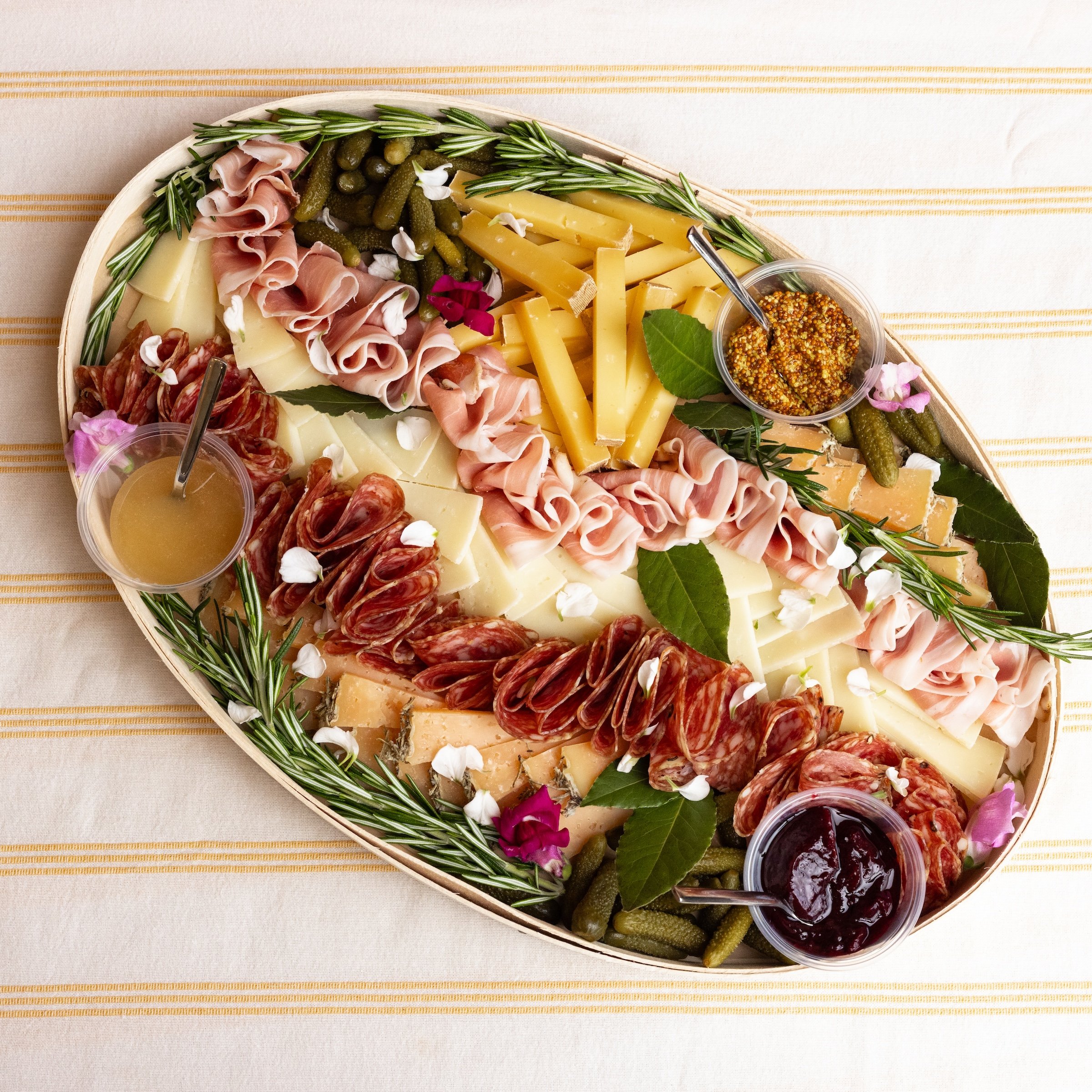 All Together Now cheese and charcuterie board with artisan cheeses, cured meats and accompaniments.