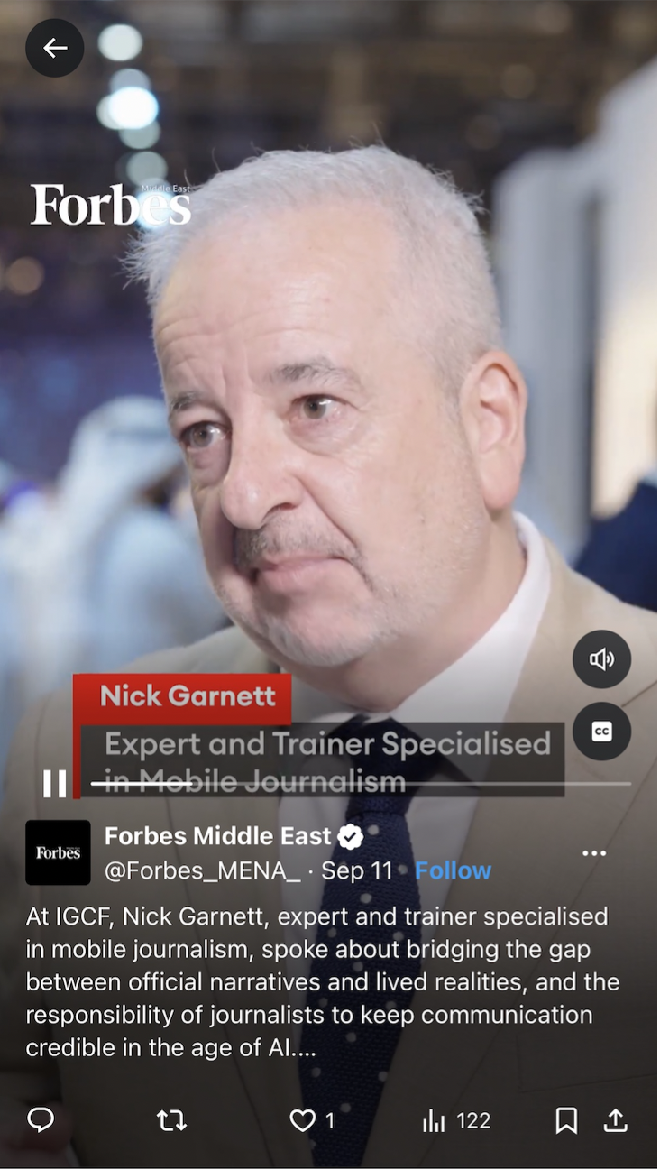A close-up of an older man with gray hair and a mustache, wearing a beige suit and a dark tie. The background is blurred. The image includes text indicating it is from Forbes, featuring Nick Garnett, an expert and trainer in mobile journalism. The text provides a brief description of his work and the context of the interview.
