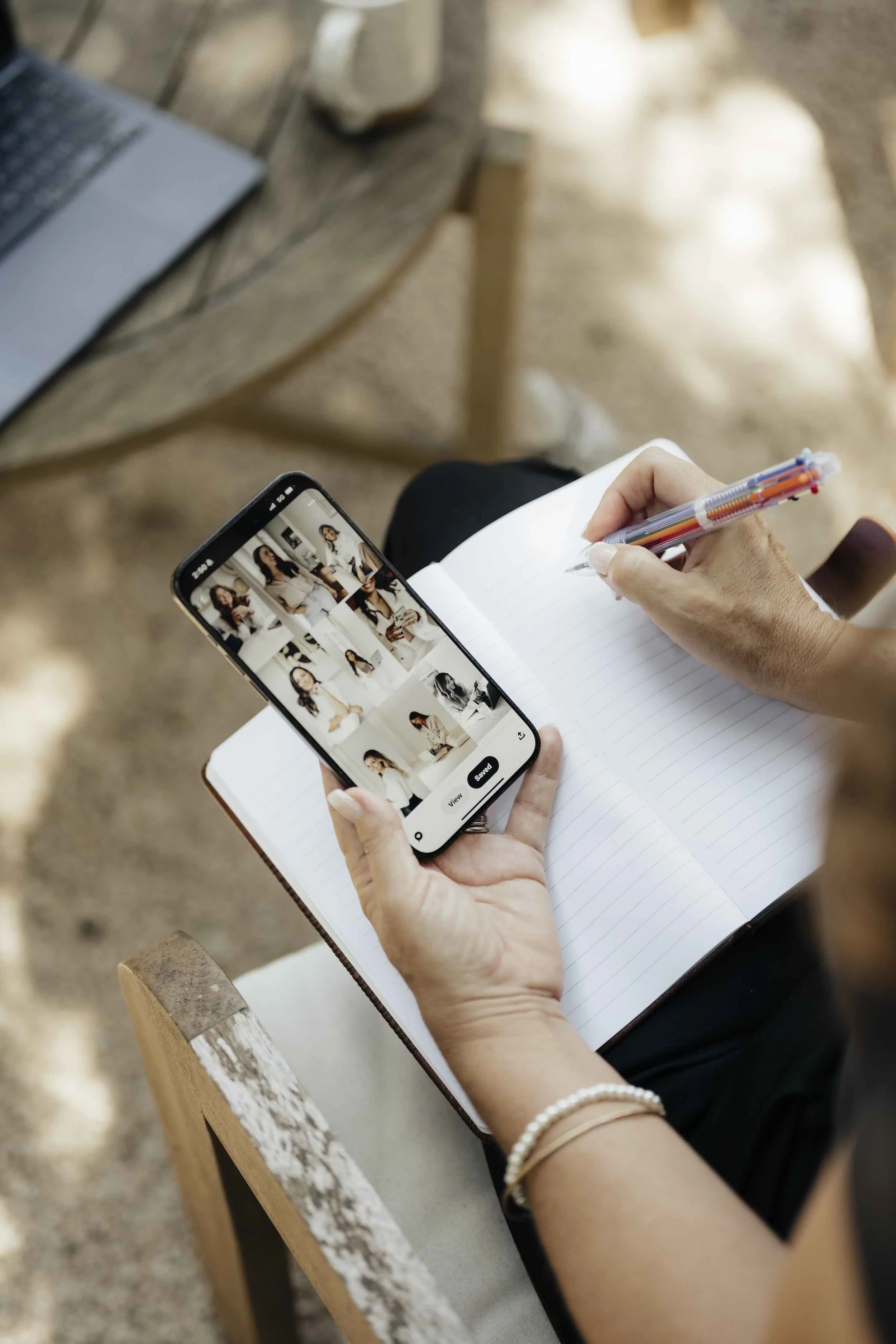 Woman on her phone looking at creative direction for her luxury branding agency