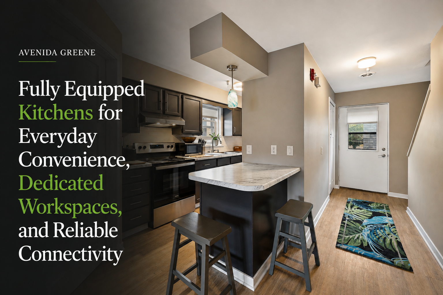 Fully equipped kitchen in a luxury furnished rental at Avenida Greene with modern appliances, island seating, and convenient living space.