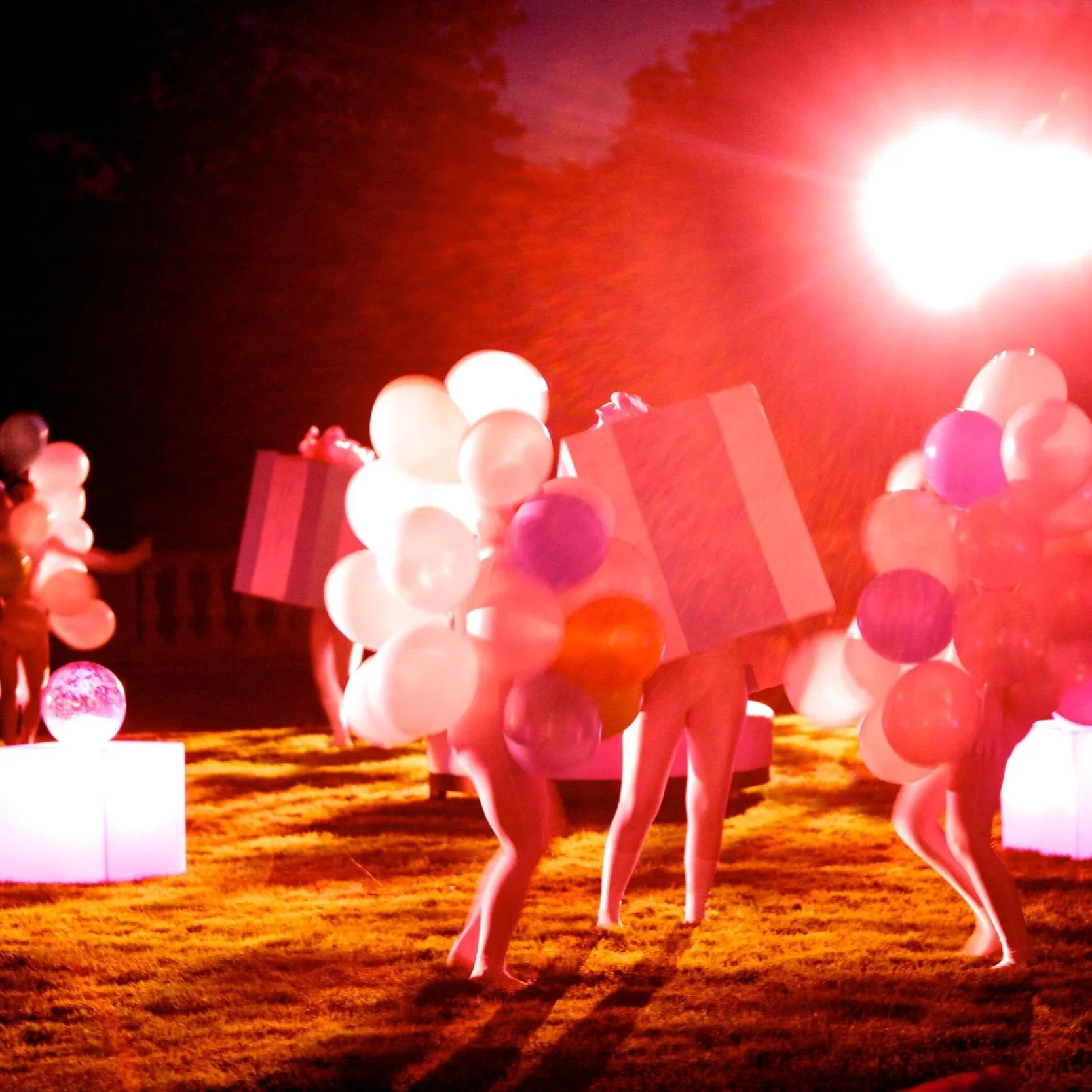 Balloon and gift wrapped dancers performing for a celebration at Oheka Castle.