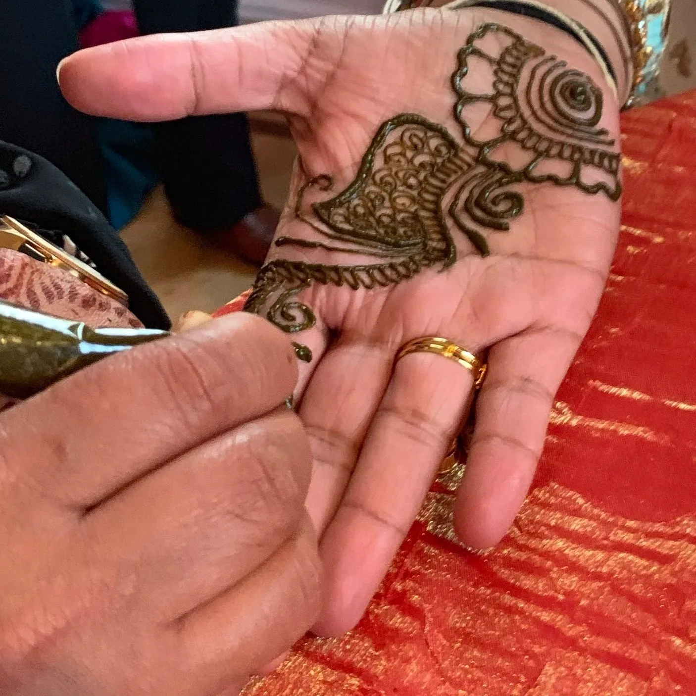 Hanna artist at the Manhattan Penthouse painting guests at the Sangeet the night before the wedding. 