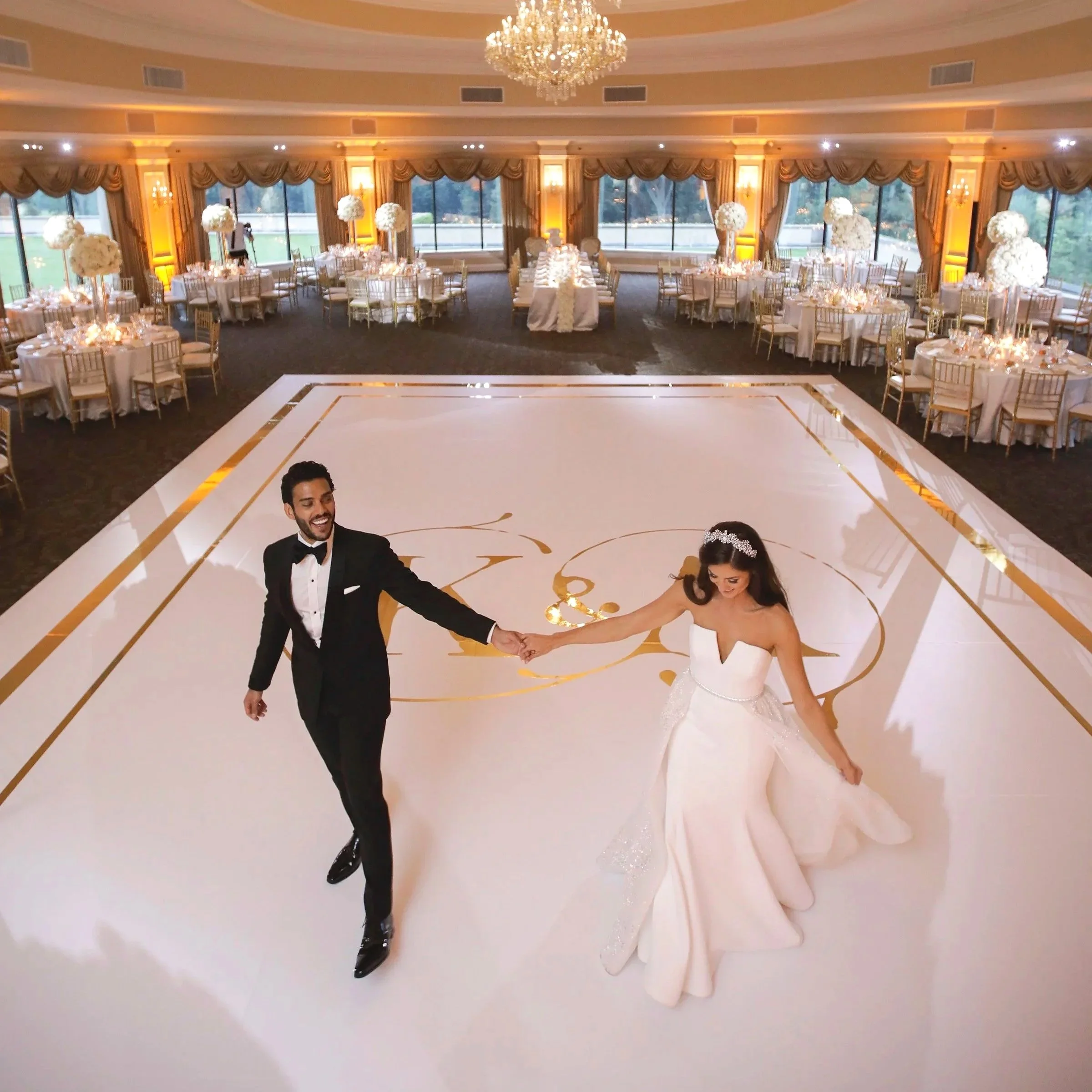Bride and Groom portrait on the dance floor in Oheka Castles ballroom moments before their wedding reception 