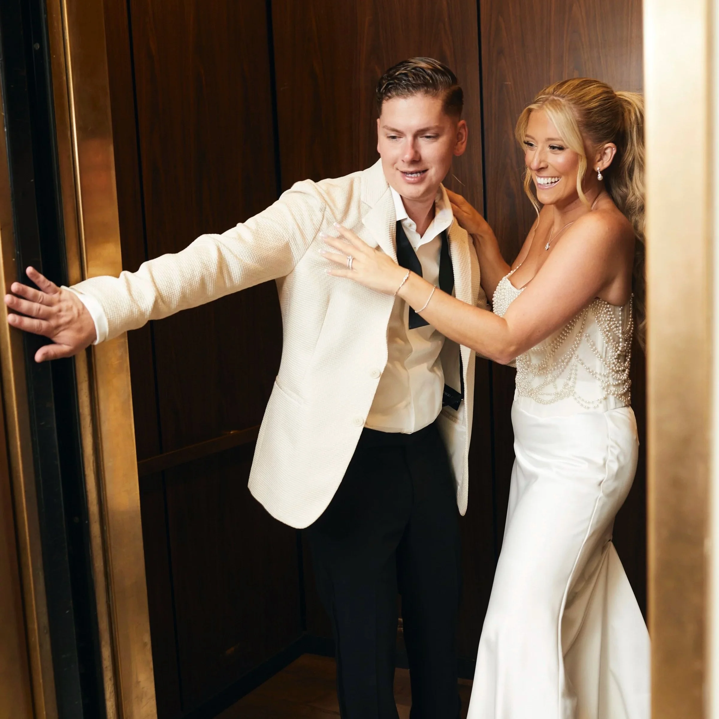 Fun Bride and Groom portrait in the elevator, late night at Oheka Castle 