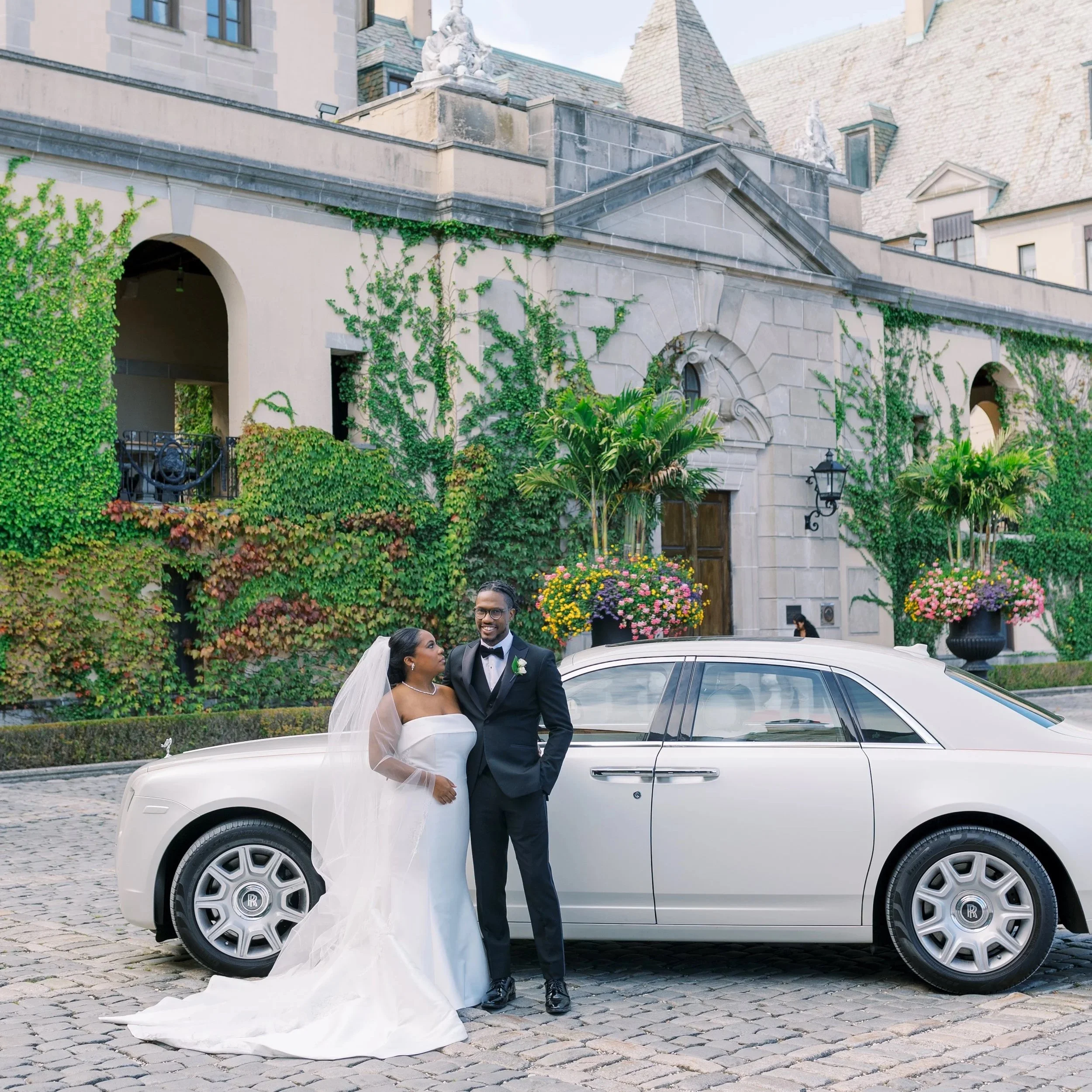 Bride and Groom portrait in the front courtyard of Oheka Castle 