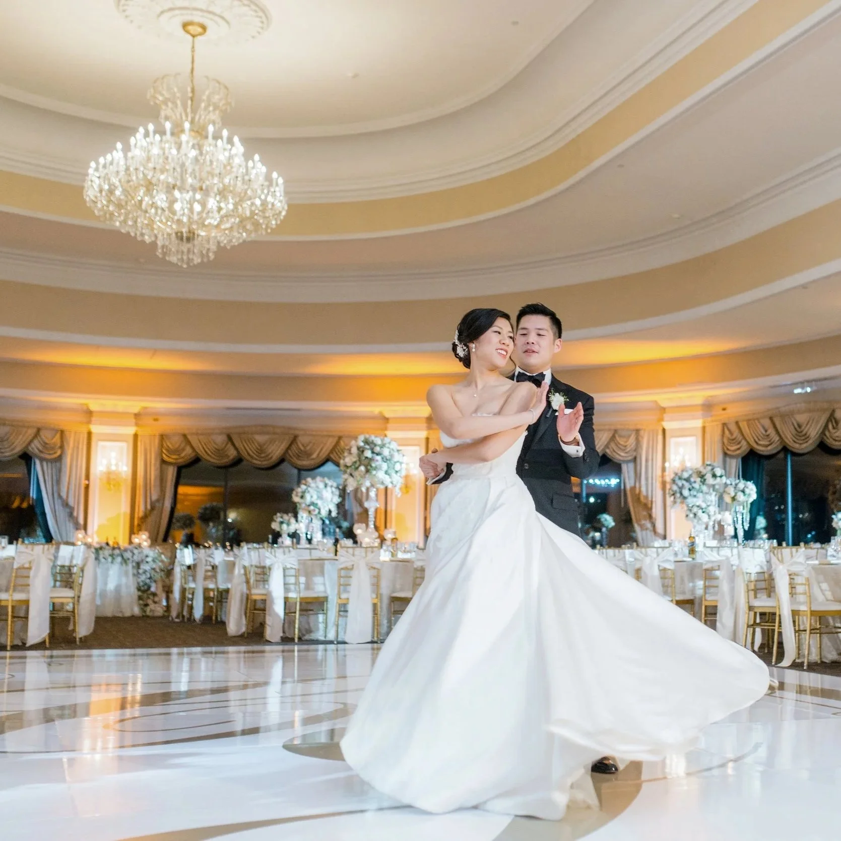 Bride and Groom practice their first dance on their custom dance floor in the Terrace Room at Oheka Castle 