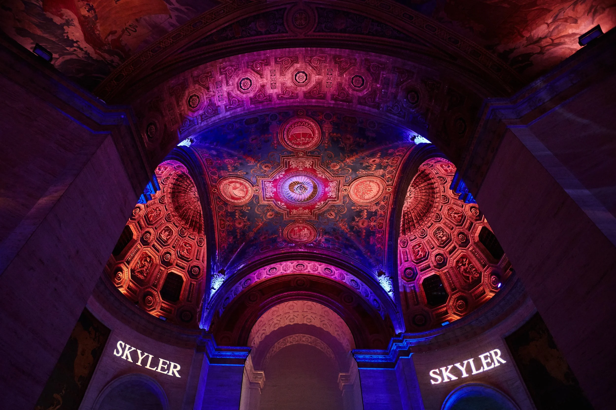 Custom monogram lighting for Skyler’s Bar Mitzvah at Cipriani Wall Street in New York City — a bold, personalized projection illuminating the historic architecture with color, scale, and dramatic impact.