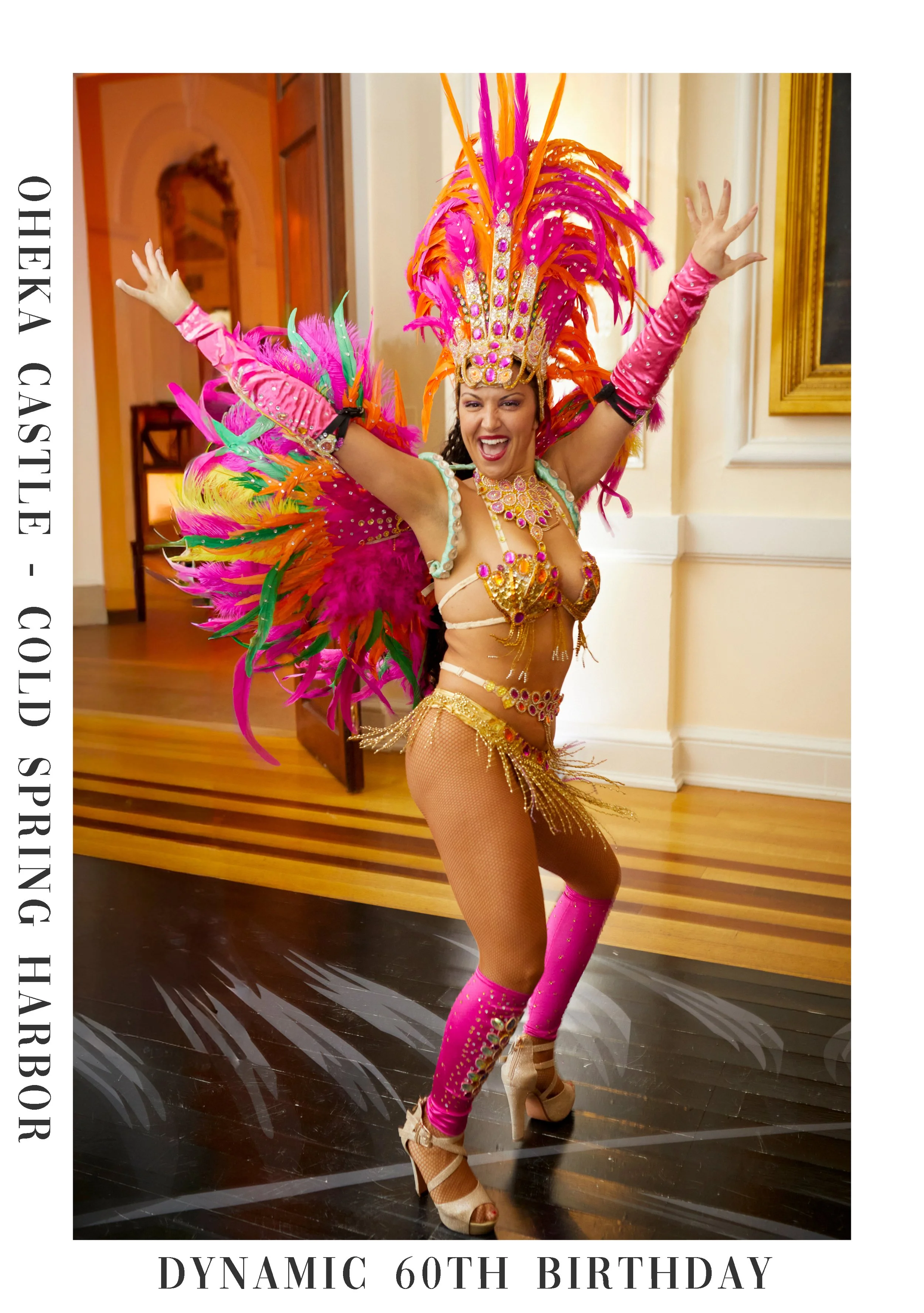 A woman in a colorful, feathered carnival costume with a tall headdress, sequins, and jewels, dancing in a decorated indoor setting, celebrating her 60th birthday.