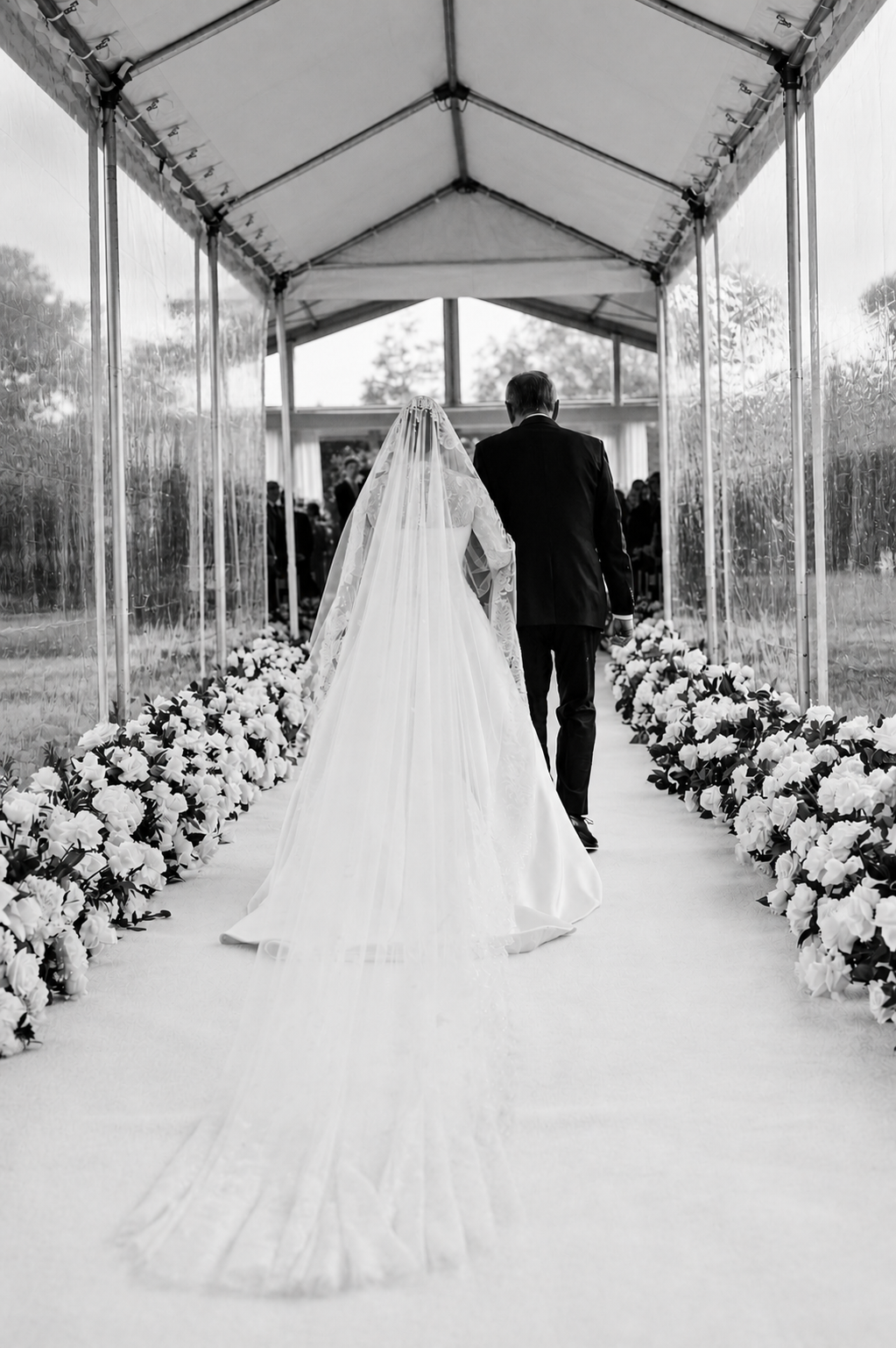Bride and her Father walking into the Ceremony tent in the water gardens of Oheka Castle.