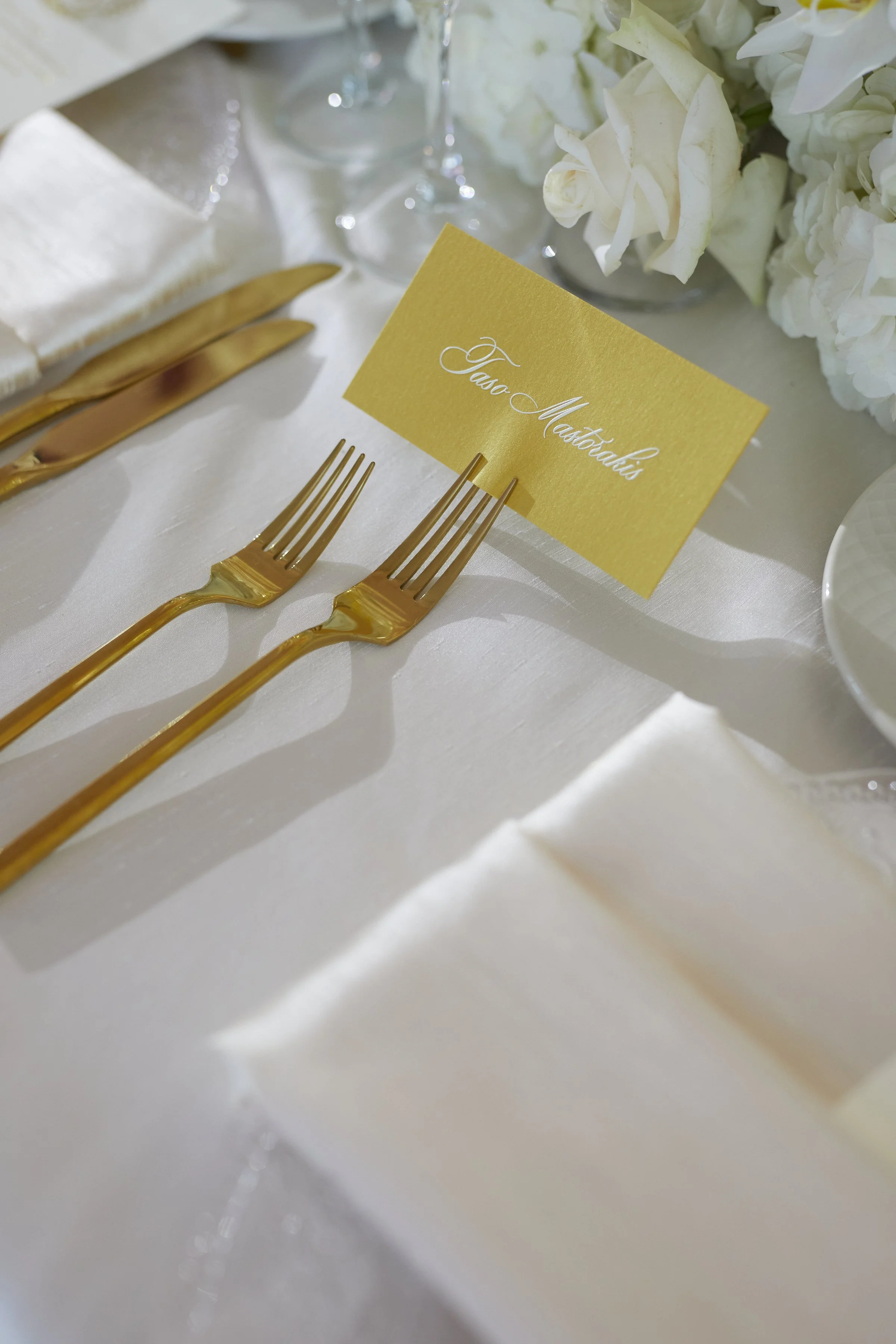 Gold escort card with white text.