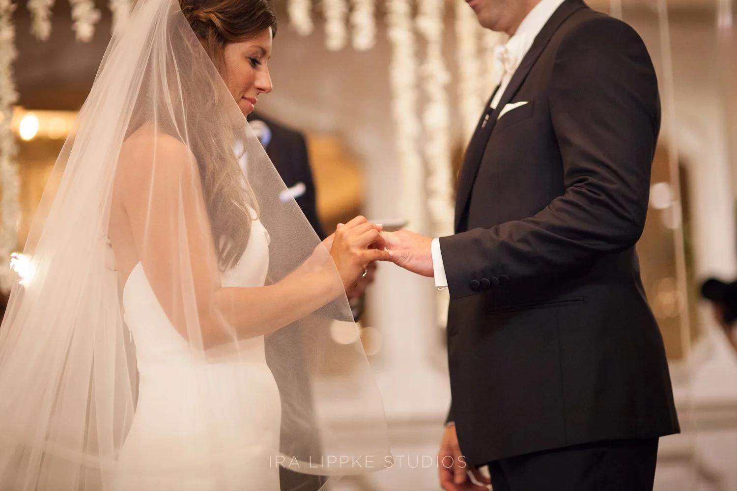 During the ceremony, the couple exchanges wedding bands, symbolizing their commitment and the beginning of married life.