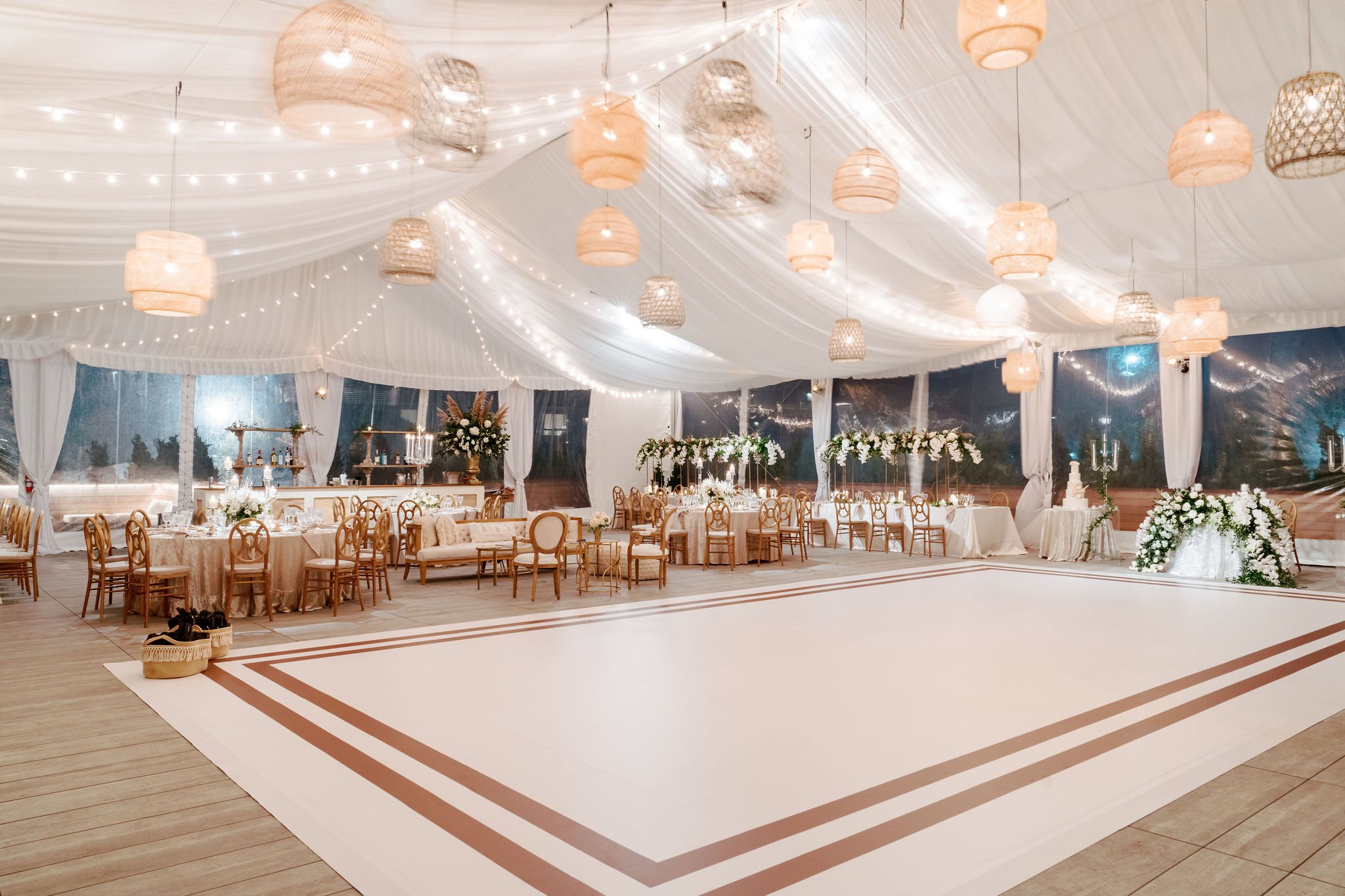 The dance floor was thoughtfully integrated into the overall design—custom-wrapped with subtle border that defined the space while complementing the neutral palette and refined coastal aesthetic.
