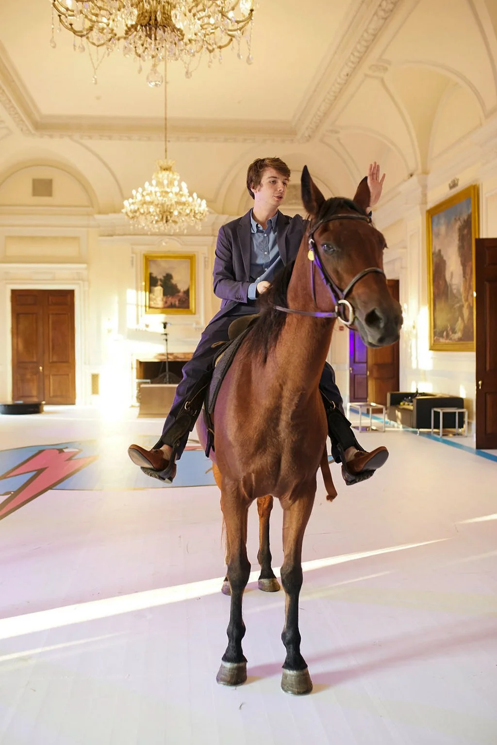 Karl Jacobs rides a horse in the Grand Ballroom at Oheka Castle