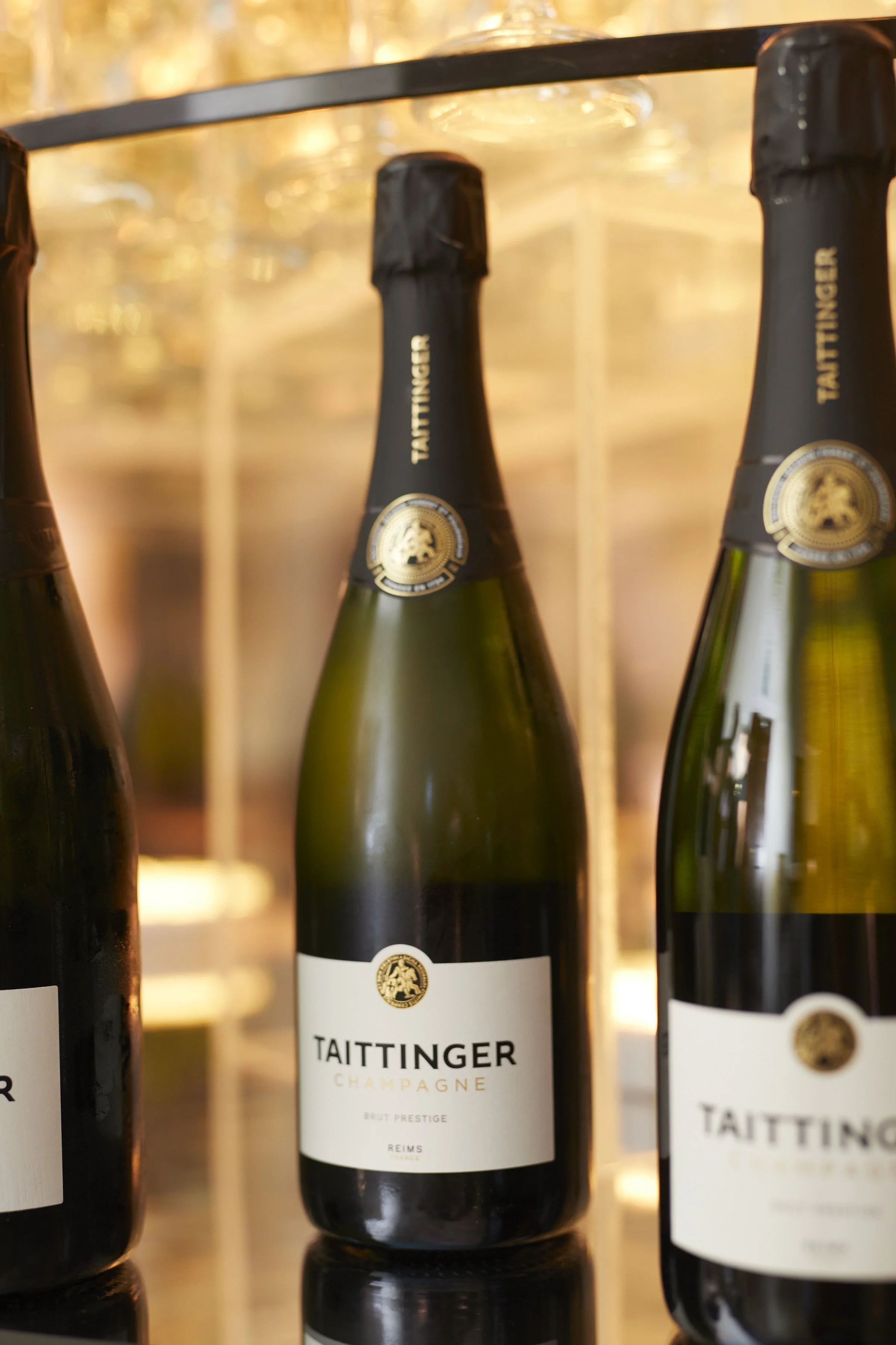 Taittinger Champagne bottles at the base of a champagne tower. 