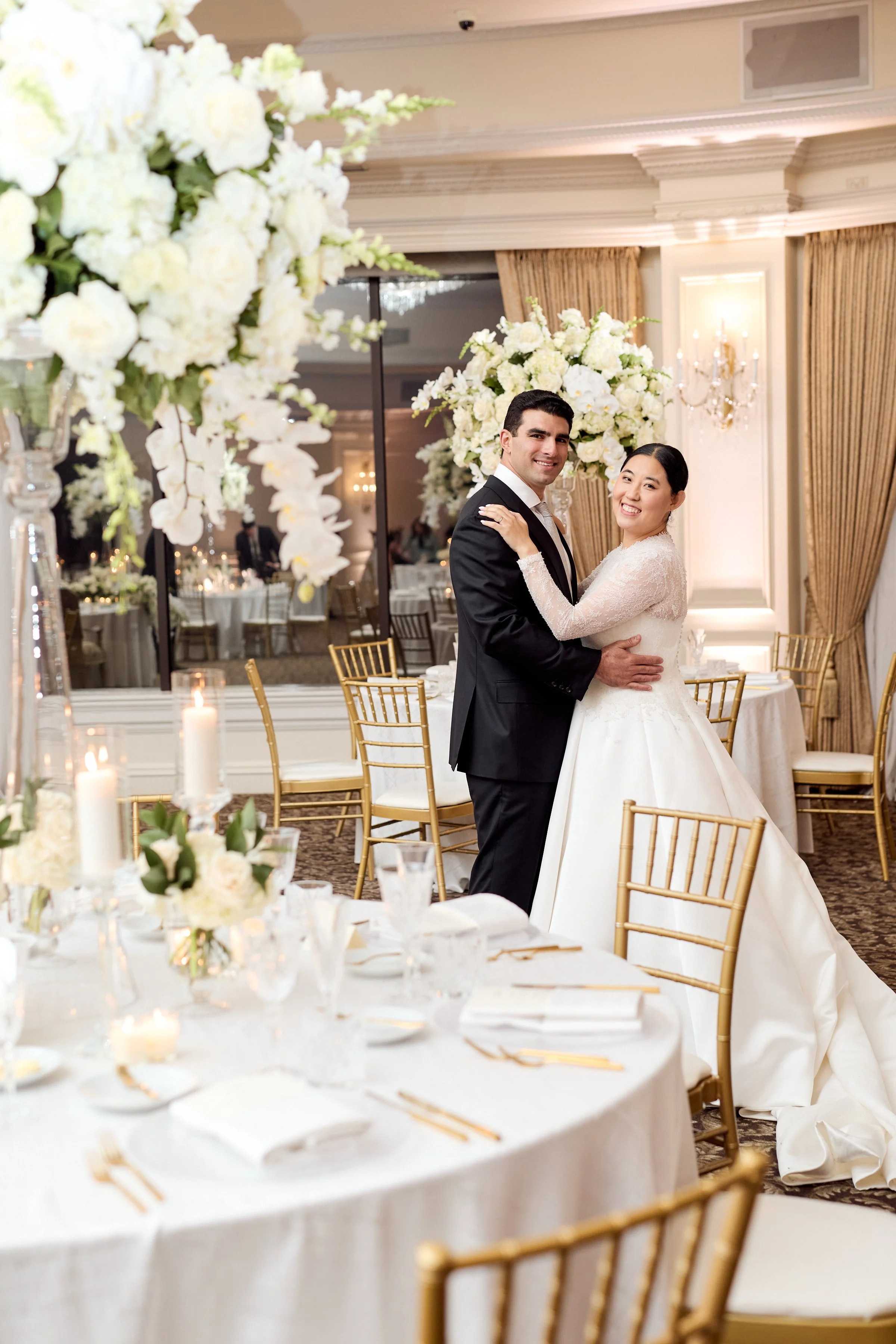 A cohesive reception space where every detail—from florals to table settings—was thoughtfully composed.