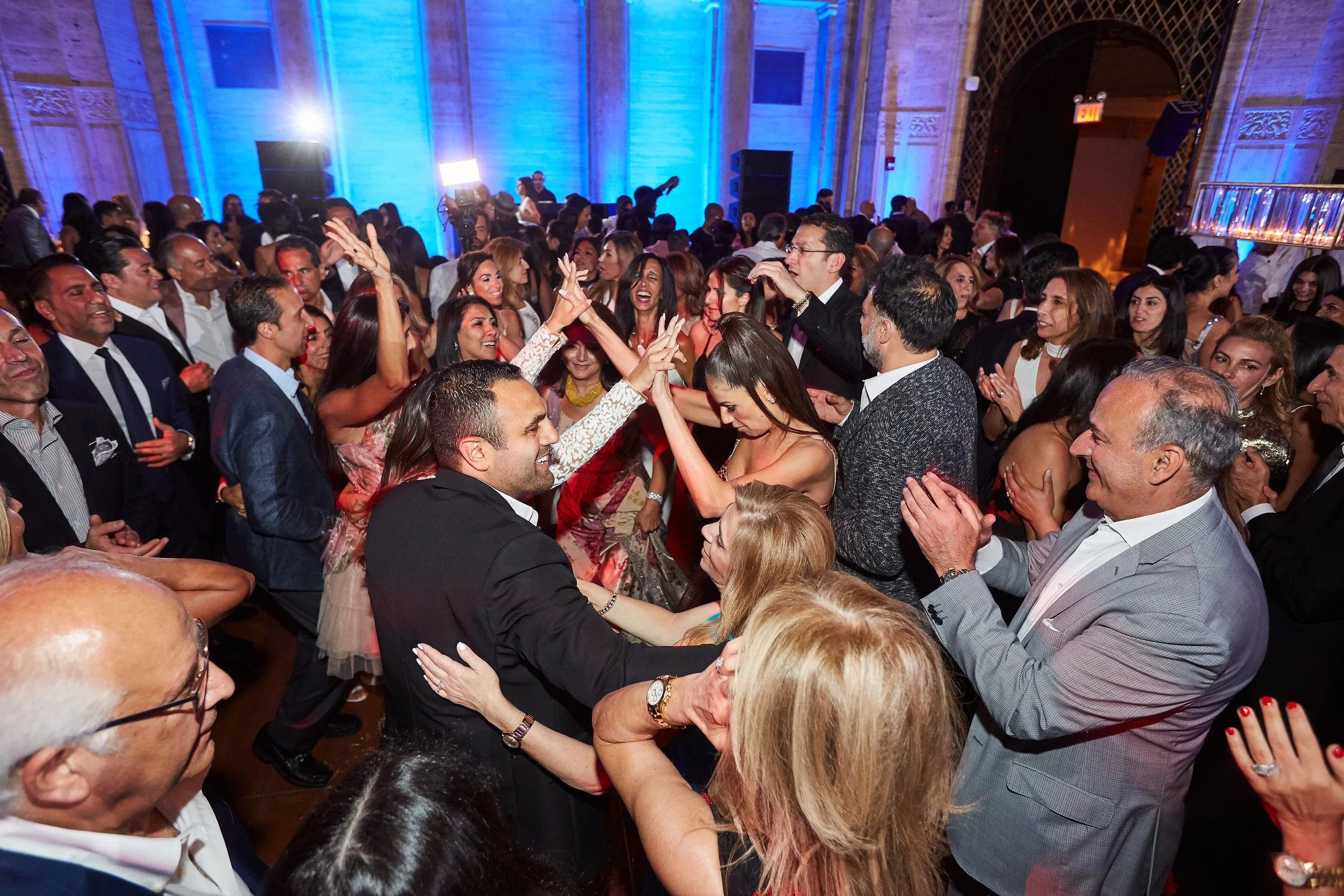 Guests dancing at a Bar Mitzvah at Cipriani Wall Street in New York City — a high-energy moment as the crowd fills the dance floor, creating an atmosphere that is vibrant, immersive, and fully alive.