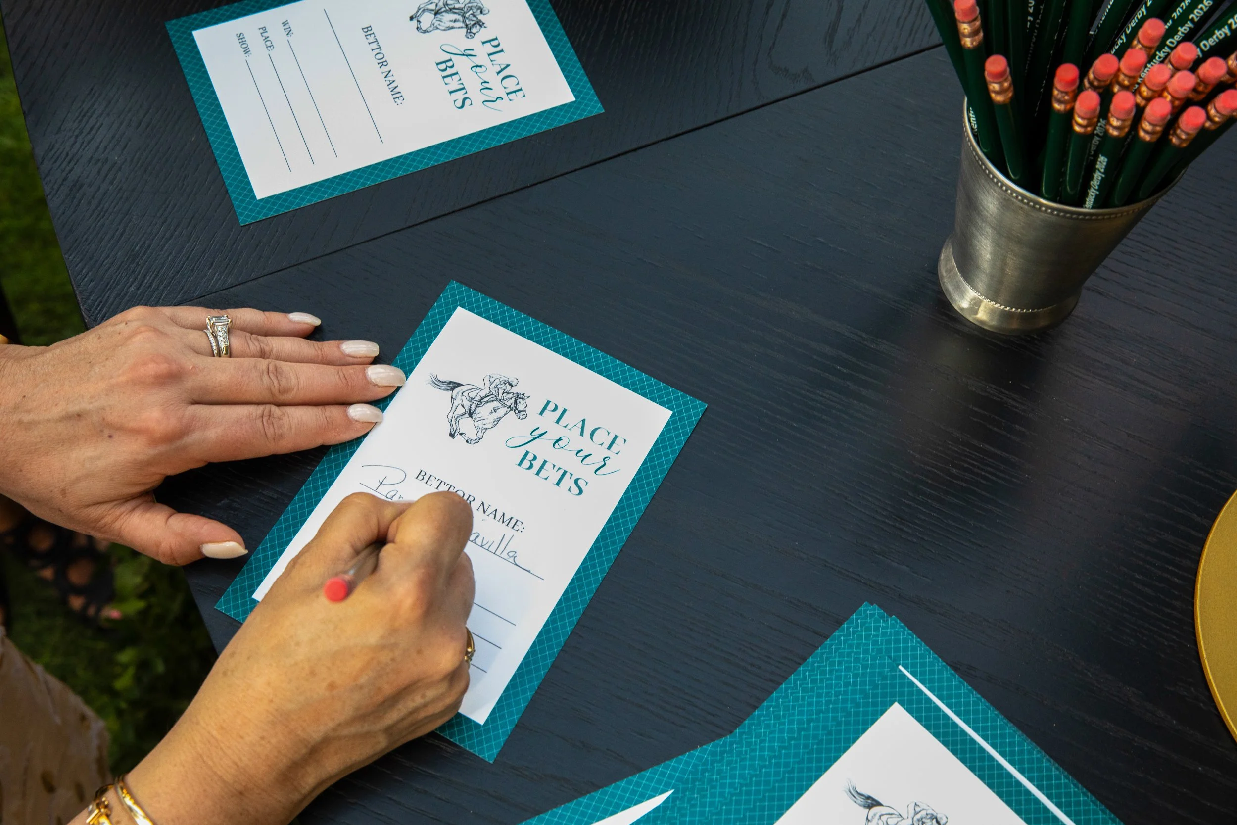 Guests placing their Derby wagers at custom-designed betting stations created exclusively for the event experience.