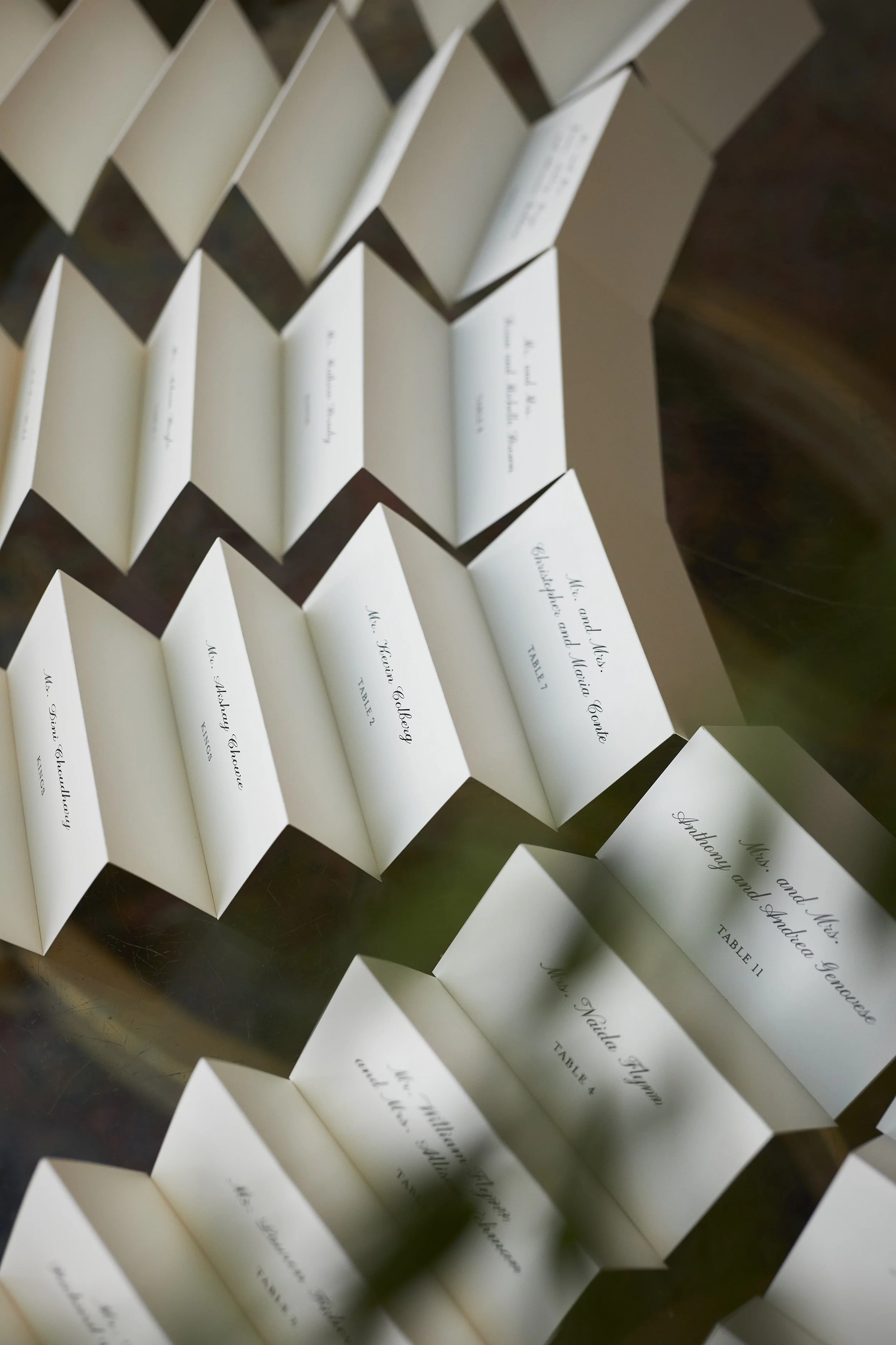 Wedding day escort card display at Oheka Castle