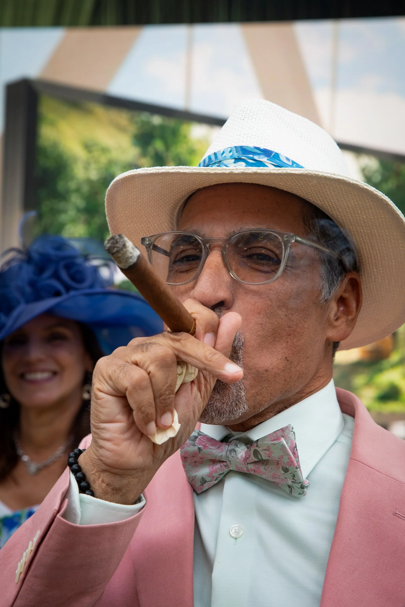Guests embraced classic Derby fashion with tailored hats, pastel suiting, and elevated race-day attire throughout the afternoon.