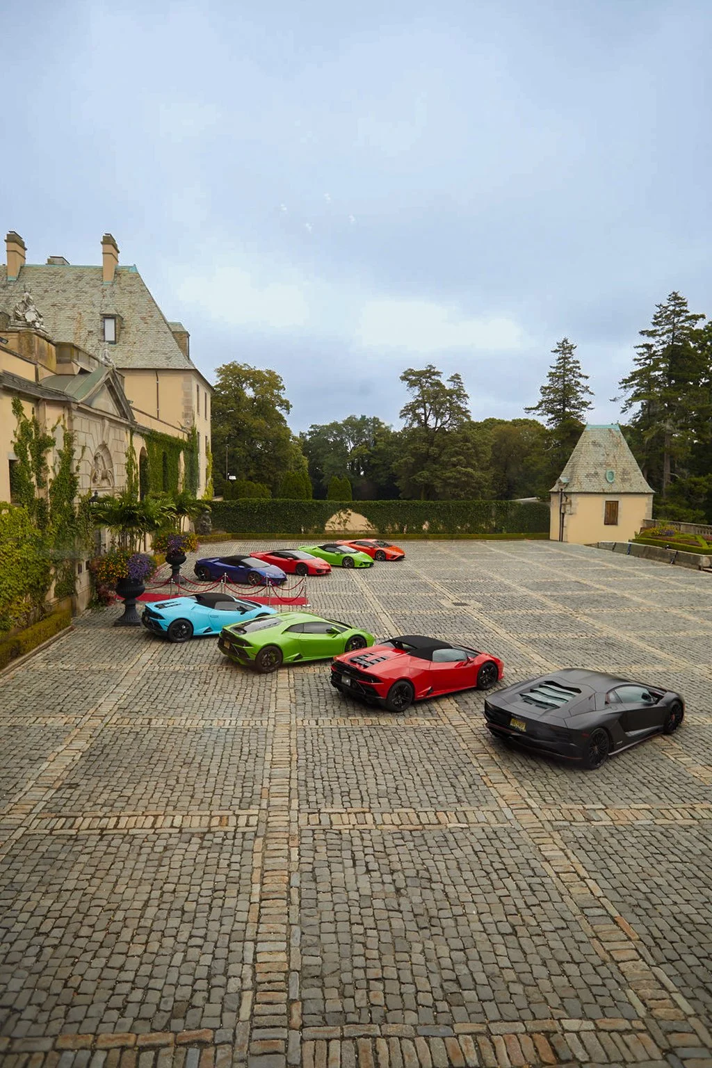 A fleet of Super Cars at Oheka Castle, side angle