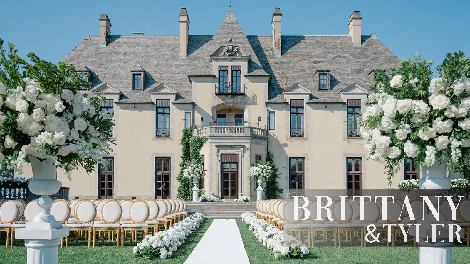 A wedding ceremony with Oheka Castle in the background 
