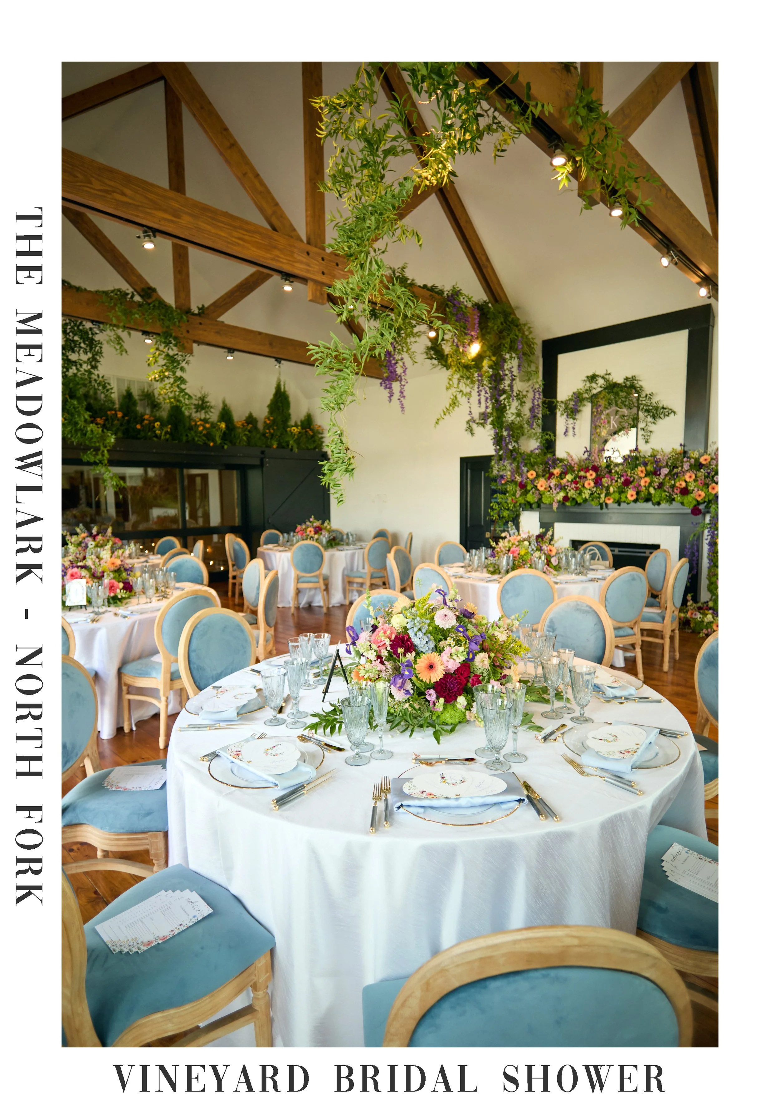 A garden-inspired bridal shower reception at The Meadowlark North Fork Vineyard featuring soft blue tones, candlelight, and refined floral arrangements designed for Kaitlyn’s celebration.