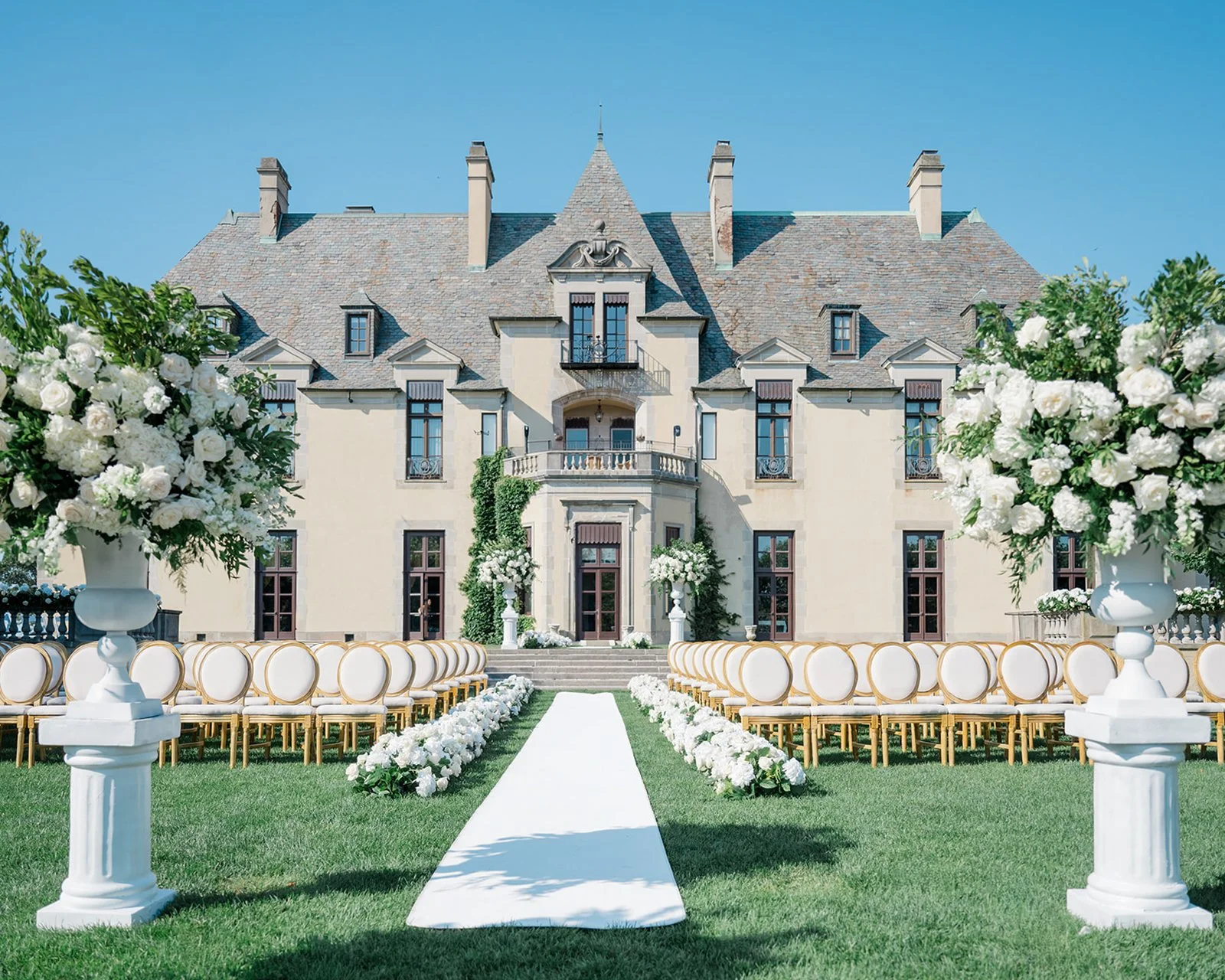 Brittany and Tyler’s Oheka Castle wedding showcases timeless elegance, refined design, and a classic black-tie celebration on Long Island. From a garden ceremony to a candlelit reception, this luxury wedding highlights elevated floral design, curated