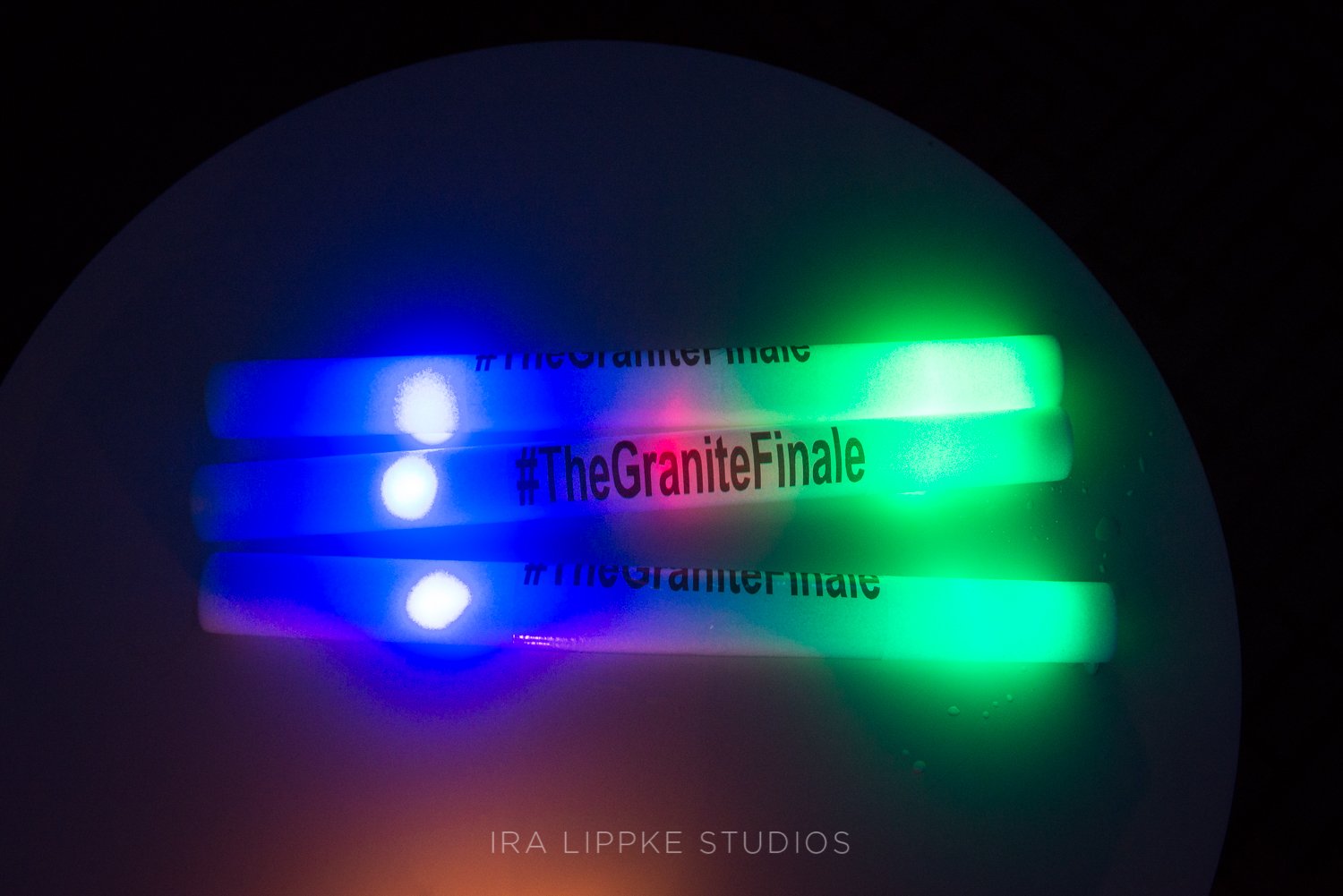 Custom glow sticks featuring the couple’s hashtag add a playful and personalized touch to the late-night celebration.