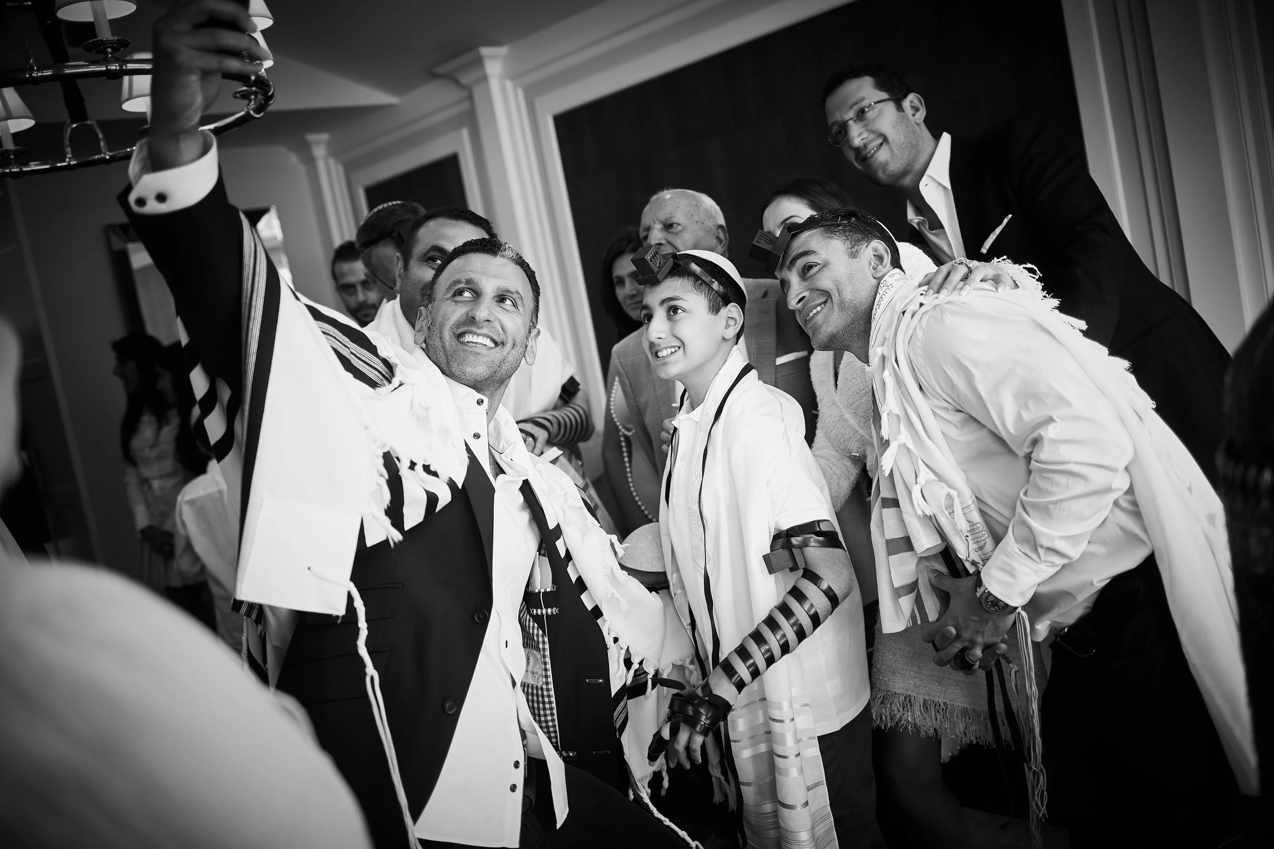 Bar Mitzvah tefillin ceremony with family at Cipriani Wall Street in New York City — a joyful, intimate moment as Skyler is surrounded by loved ones, capturing the spirit of tradition, connection, and celebration.