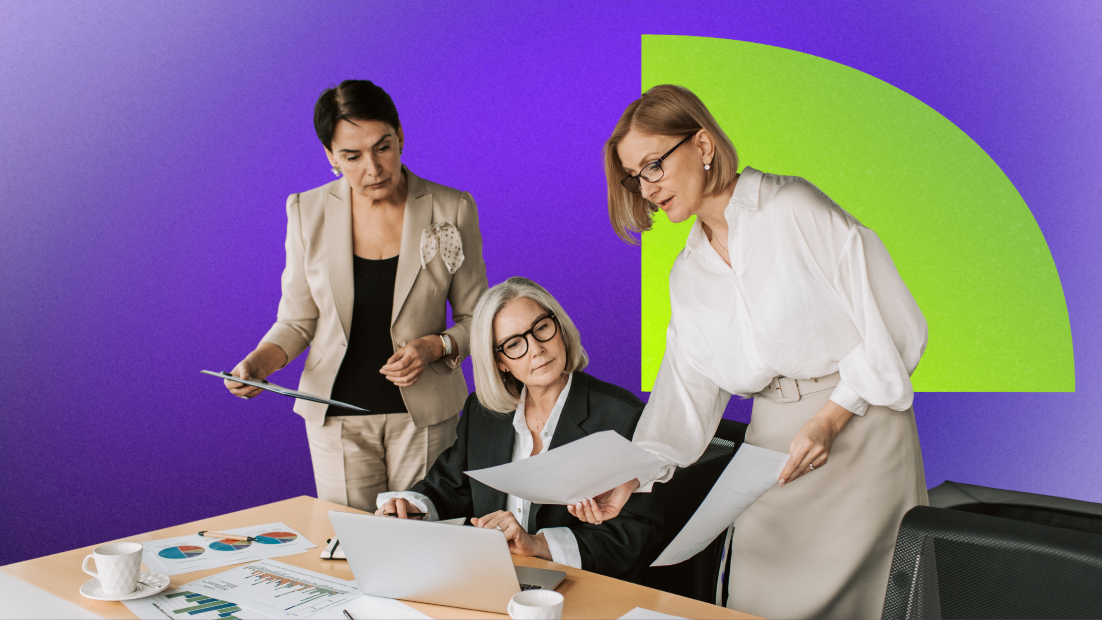 Four professional women in a business meeting, reviewing documents and discussing at a table with charts, laptops, and coffee cups, against a purple background with green geometric shapes.